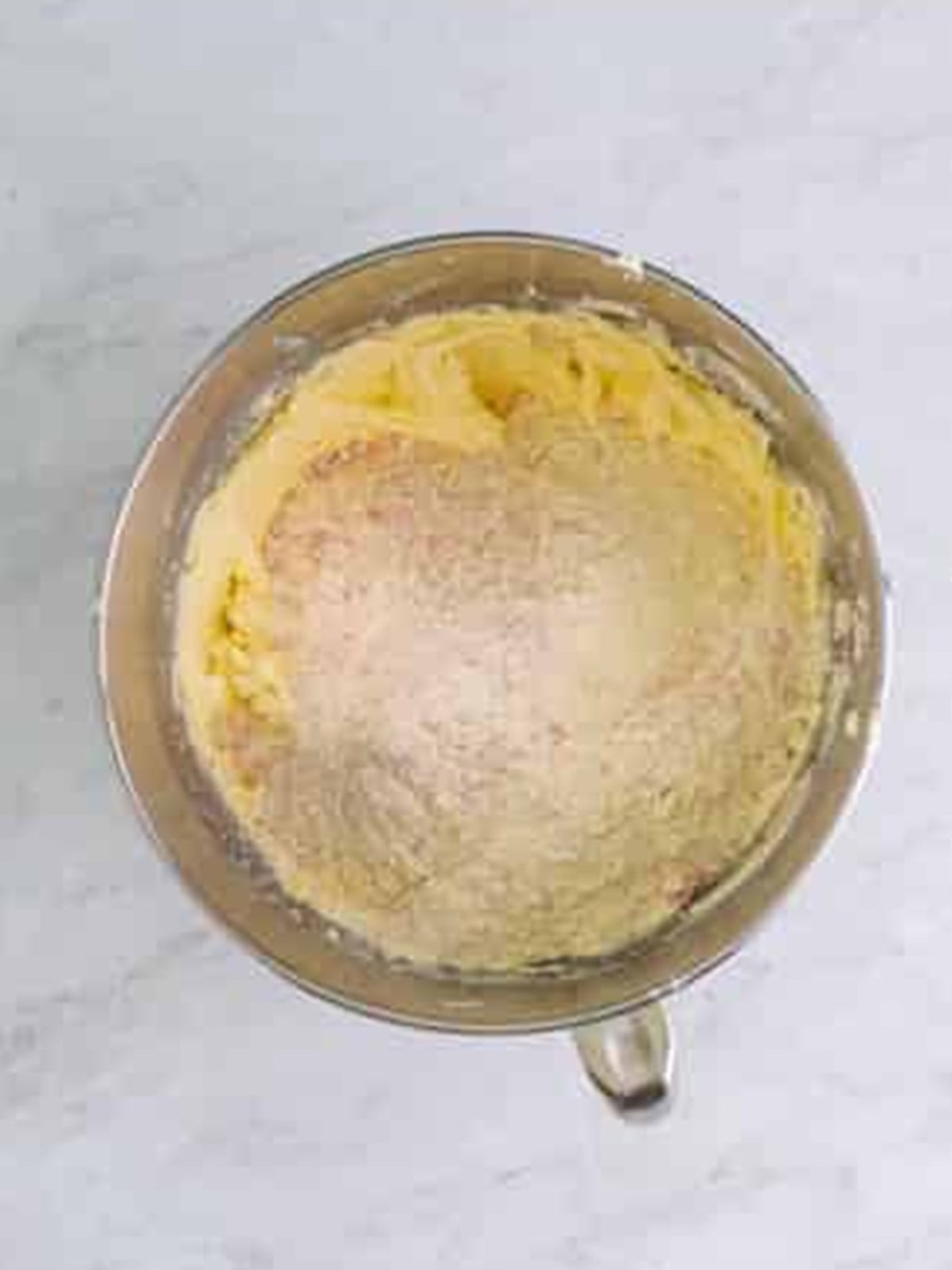 Adding dry ingredients to the Strawberry Cookies dough.