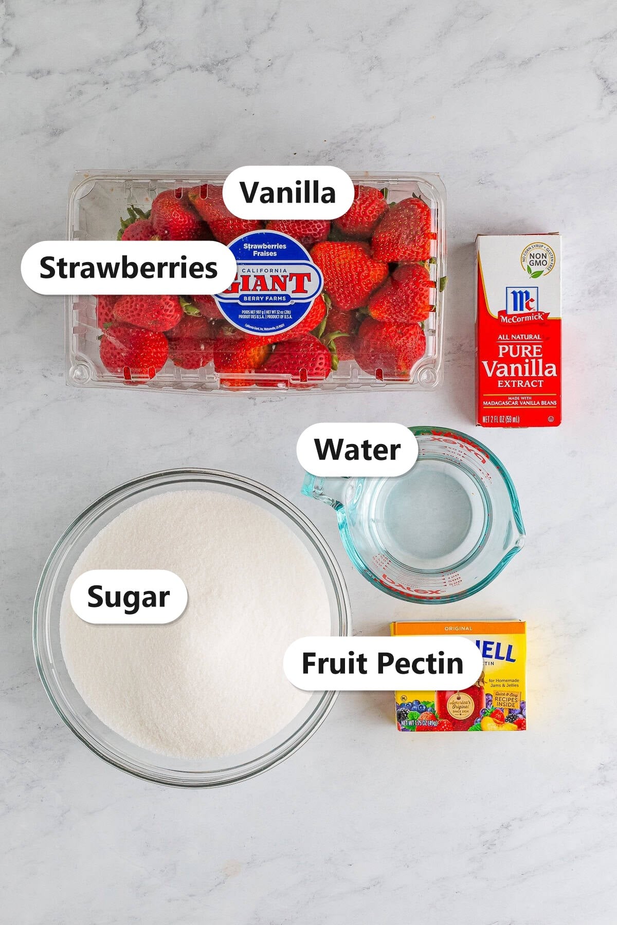 Strawberry freezer jam ingredients labeled: strawberries, sugar, vanilla, water, and fruit pectin.