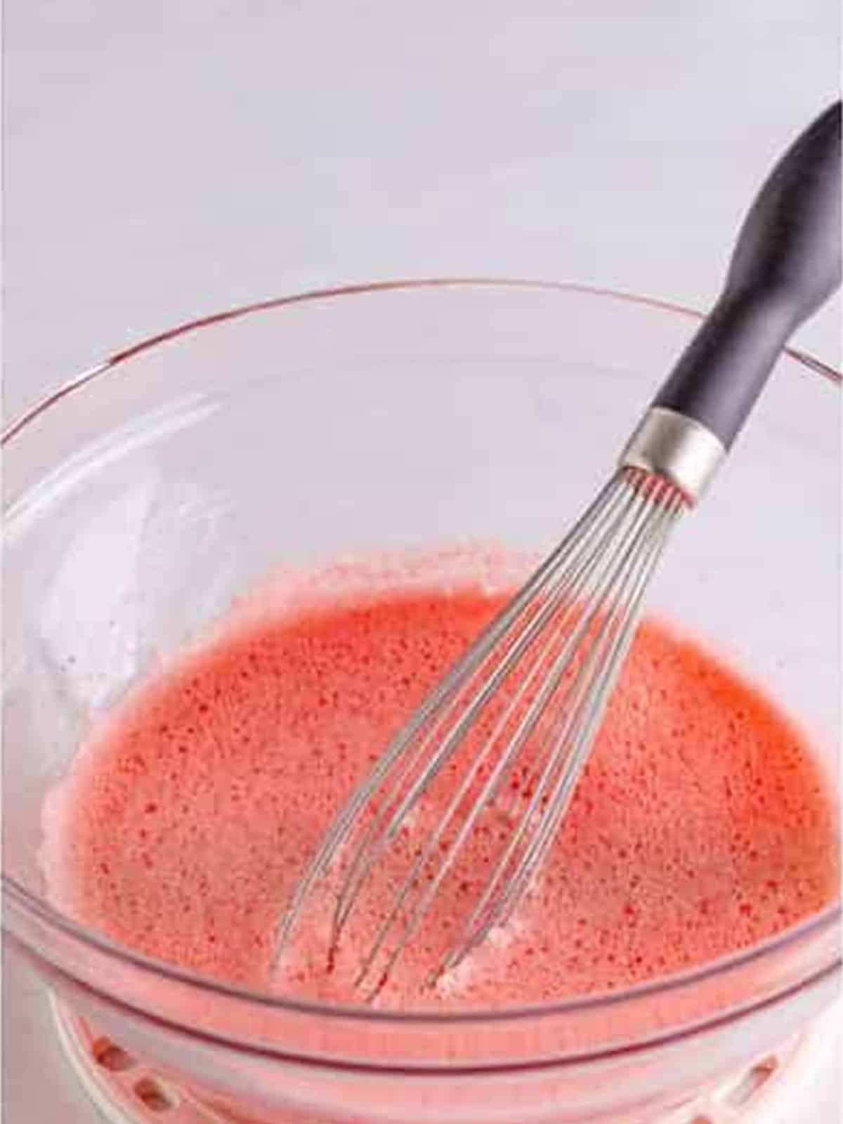 Strawberry jello whisked with ice water until slightly thickened.