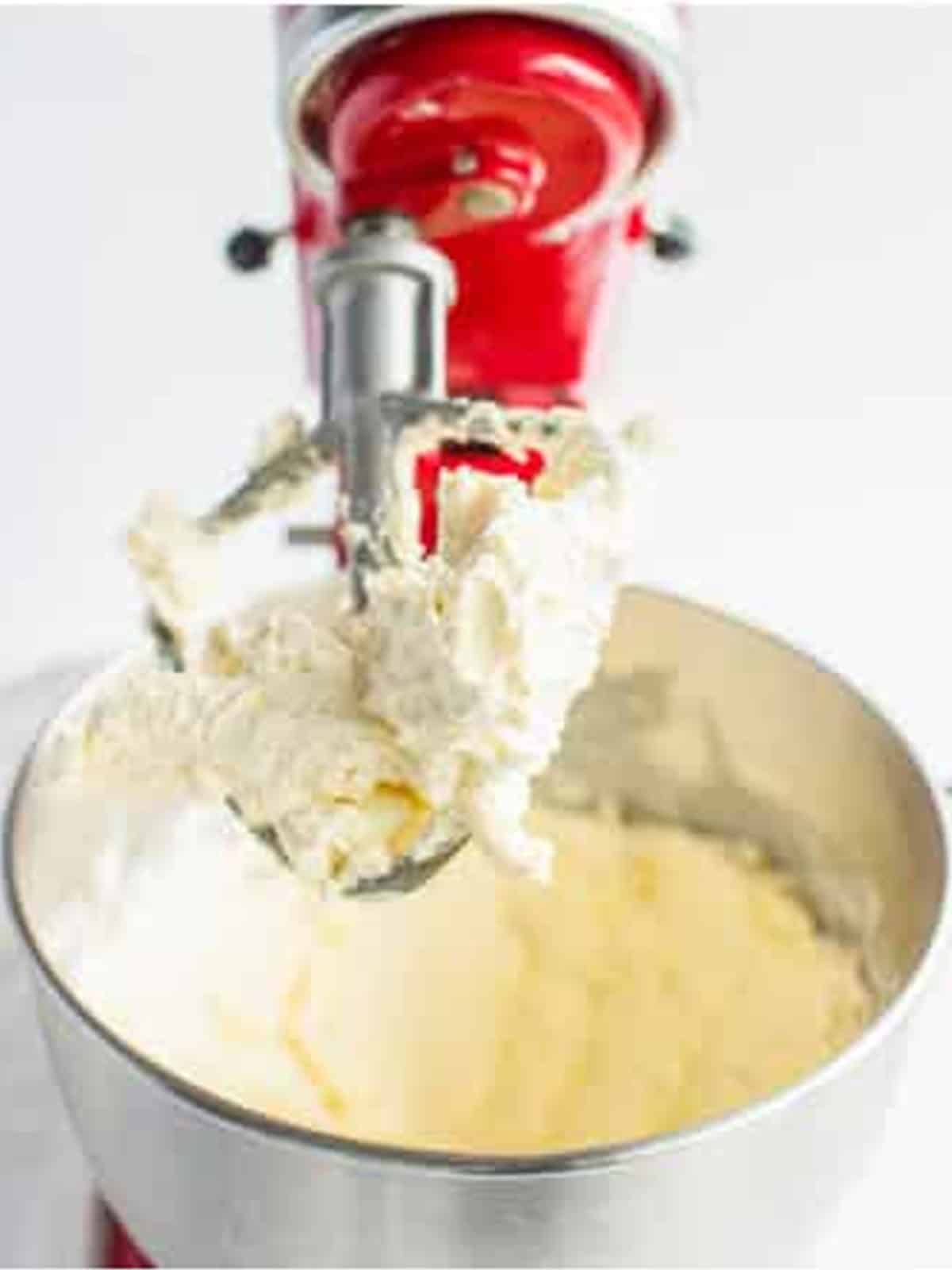 Cream cheese creamed smooth in a stand mixer for the cheesecake layer.
