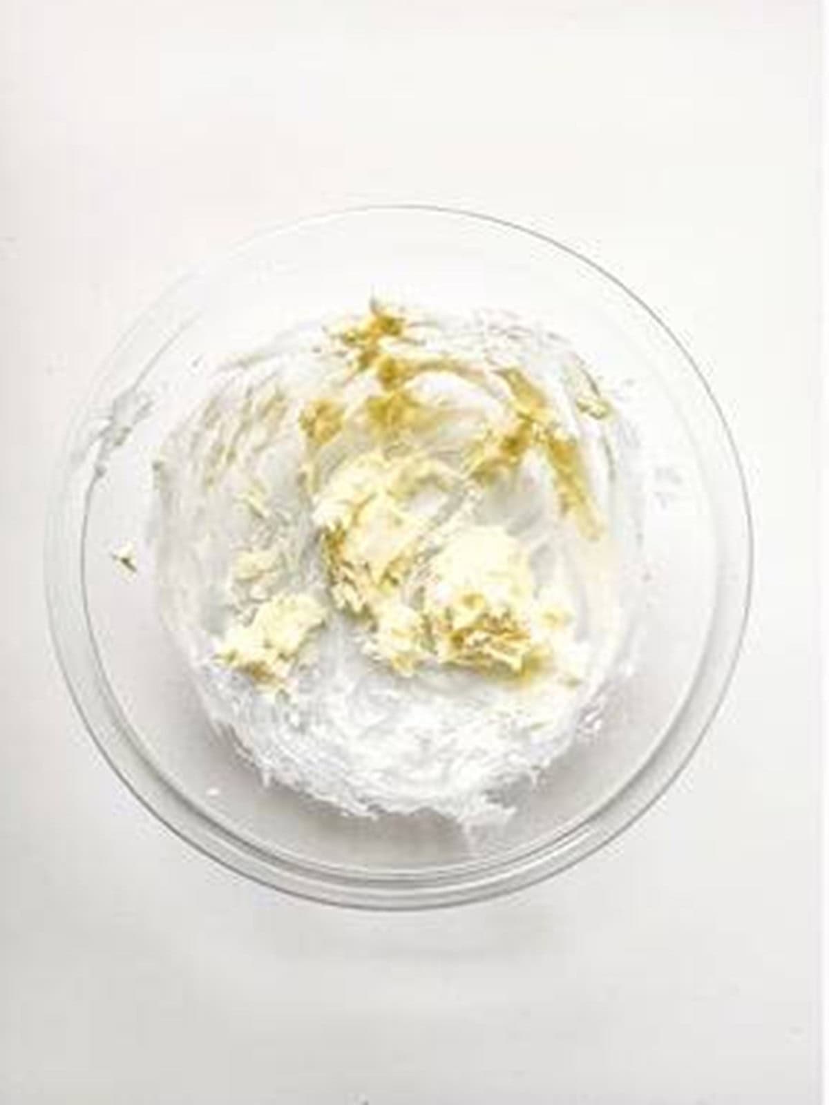 Butter and sugars creamed together in a bowl to start strawberry shortcake cookies.