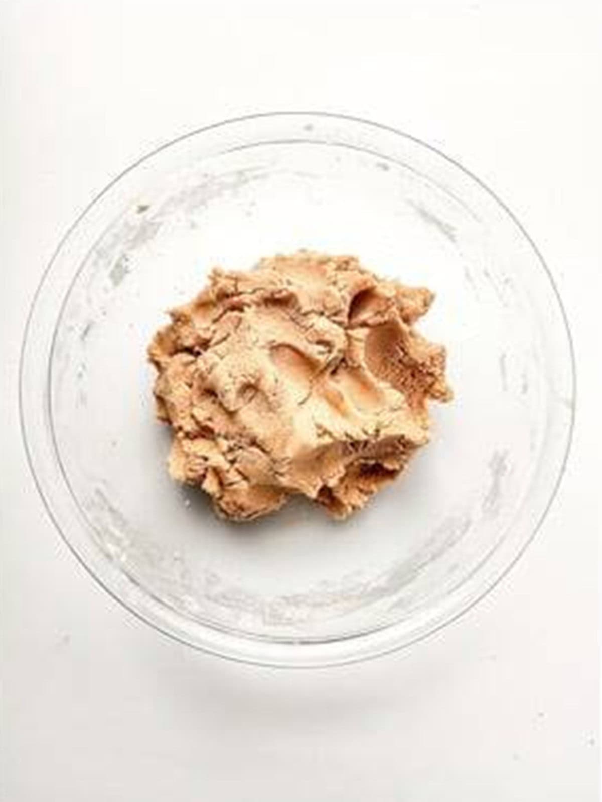 Strawberry shortcake cookie dough mixed until combined in a bowl.