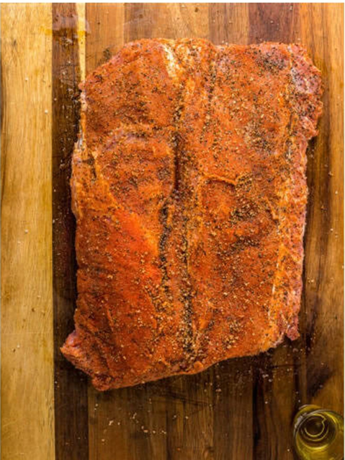Butterflied pork loin seasoned with a spice rub.