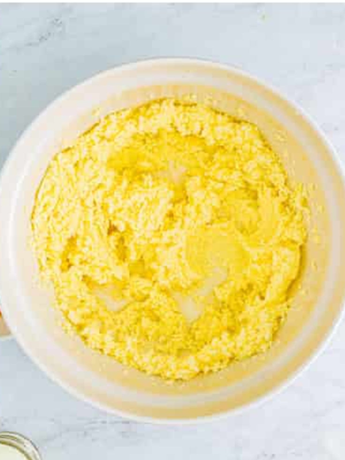 Creaming butter and sugar together in a bowl for sugar cookies