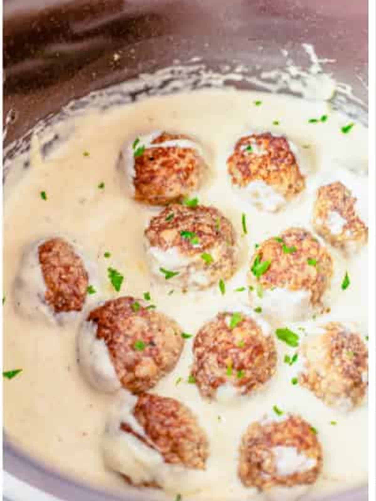 Swedish meatballs returned to the creamy sauce and garnished with parsley.