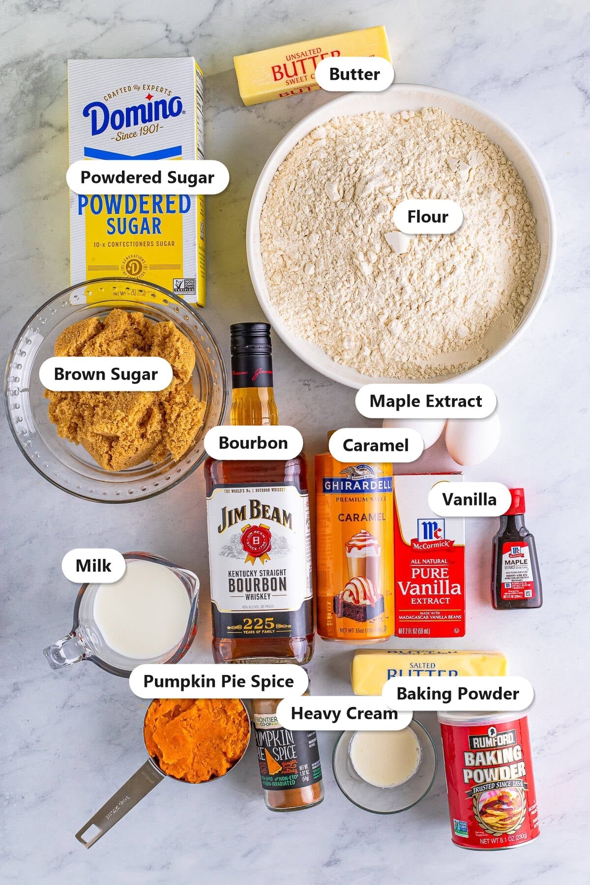 Ingredients for sweet potato cake including flour, brown sugar, butter, sweet potato, bourbon, pumpkin pie spice, and maple frosting ingredients.