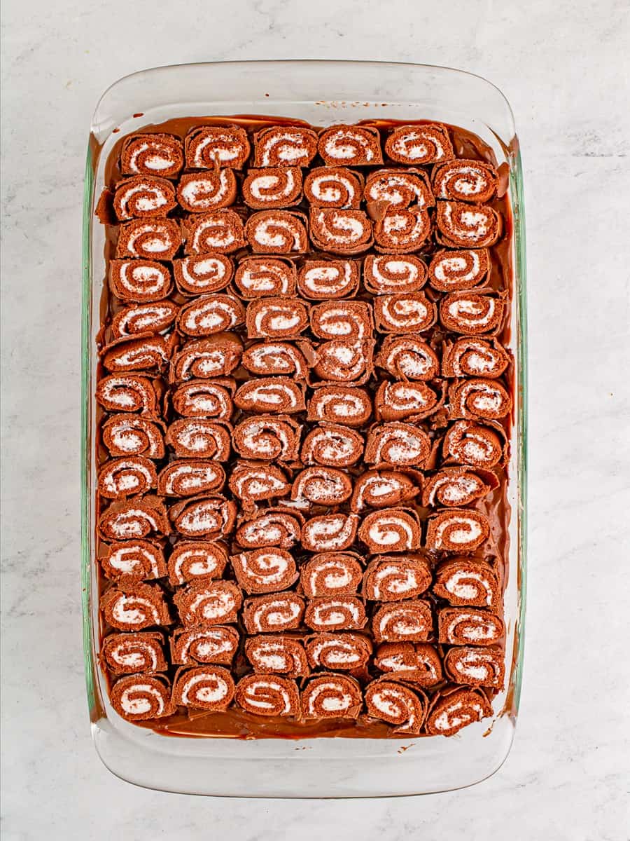 Another layer of swiss cake rolls added on top.