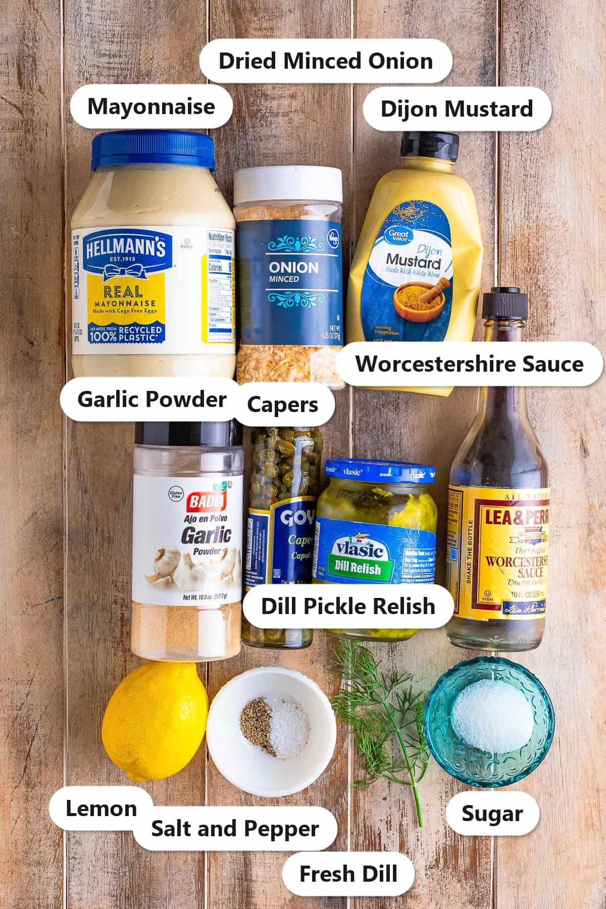Labeled ingredients for tartar sauce including mayonnaise, dill pickle relish, capers, dijon mustard, fresh dill, lemon, and Worcestershire sauce.