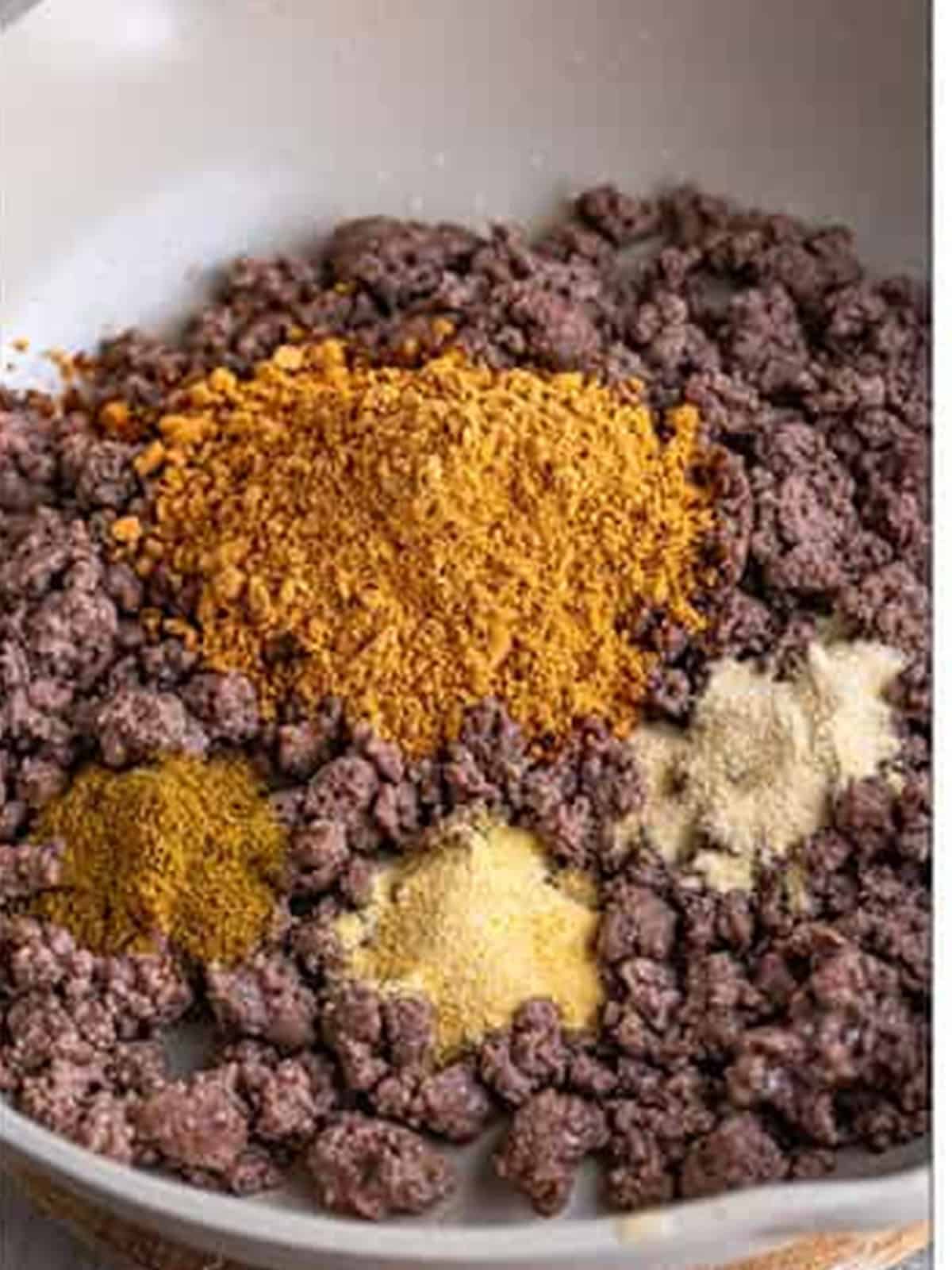 Browning ground beef with taco seasoning for Tater Tot Nachos.