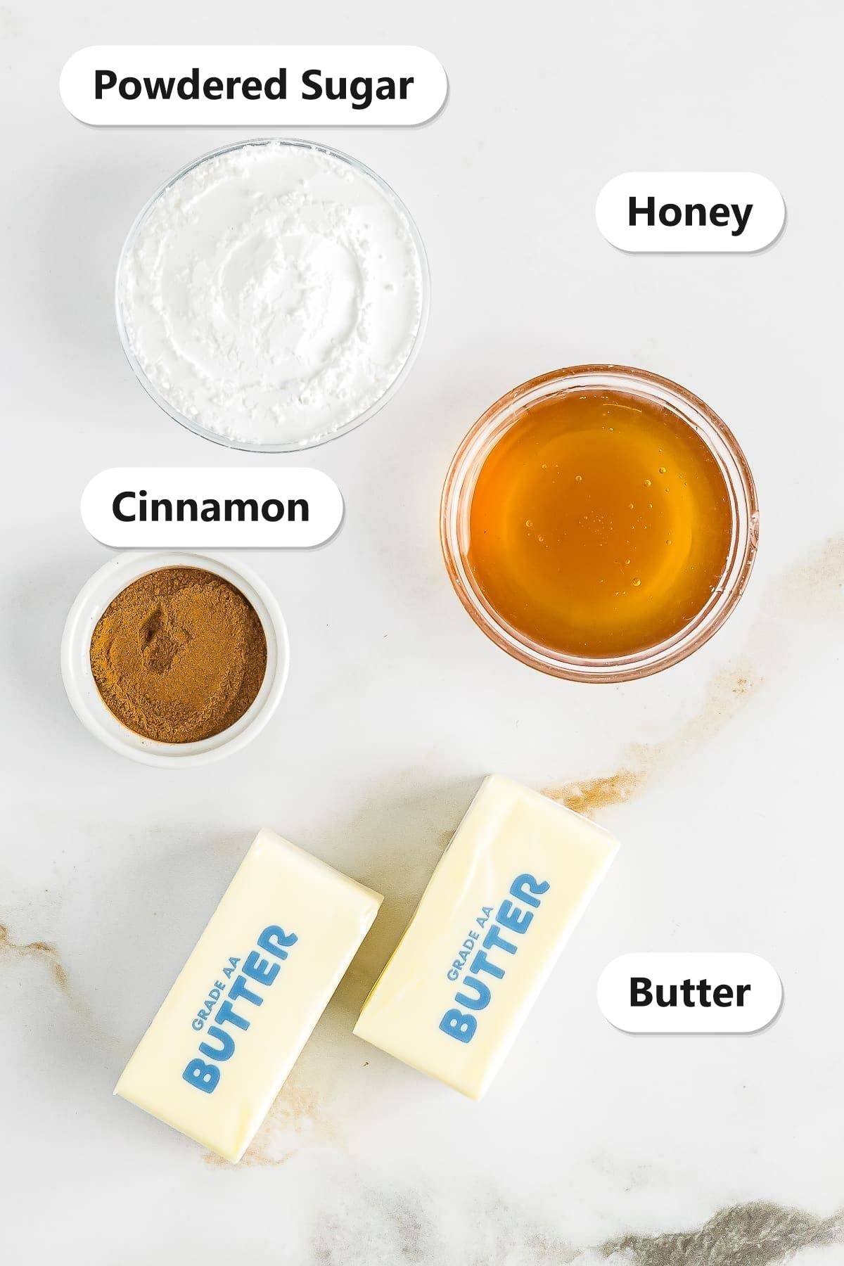 Labeled ingredients for Texas Roadhouse butter: powdered sugar, honey, cinnamon, and butter.