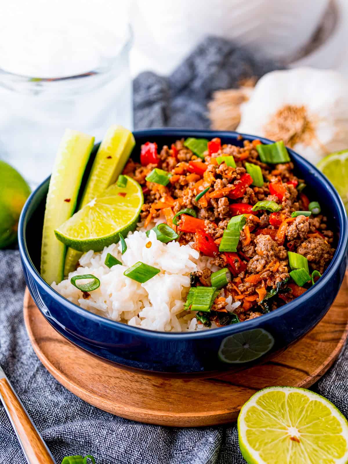 Thai beef bowl served over coconut rice with lime and scallions.
