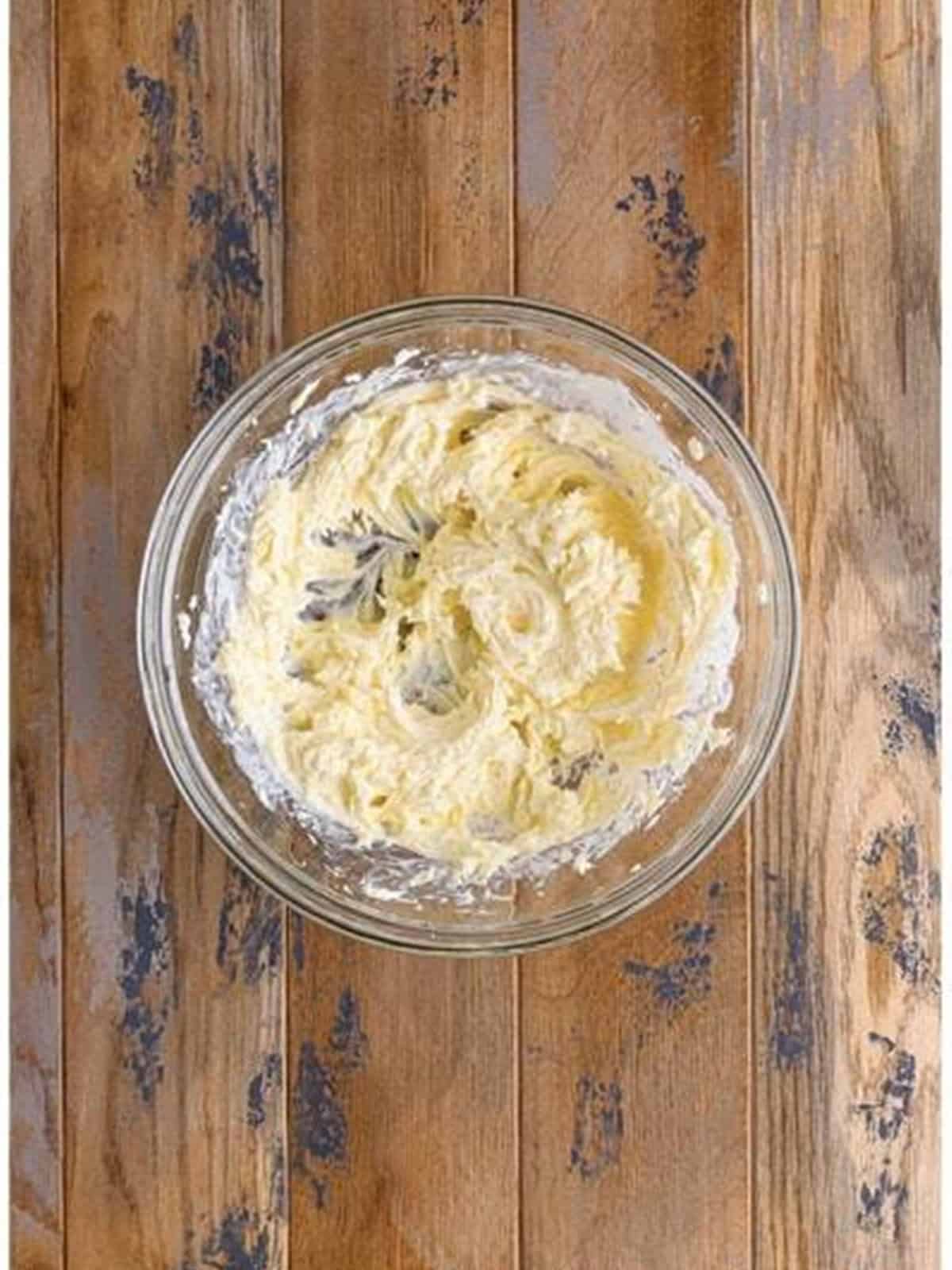 Mascarpone and cream cheese whipped together in a glass bowl for tiramisu dip.