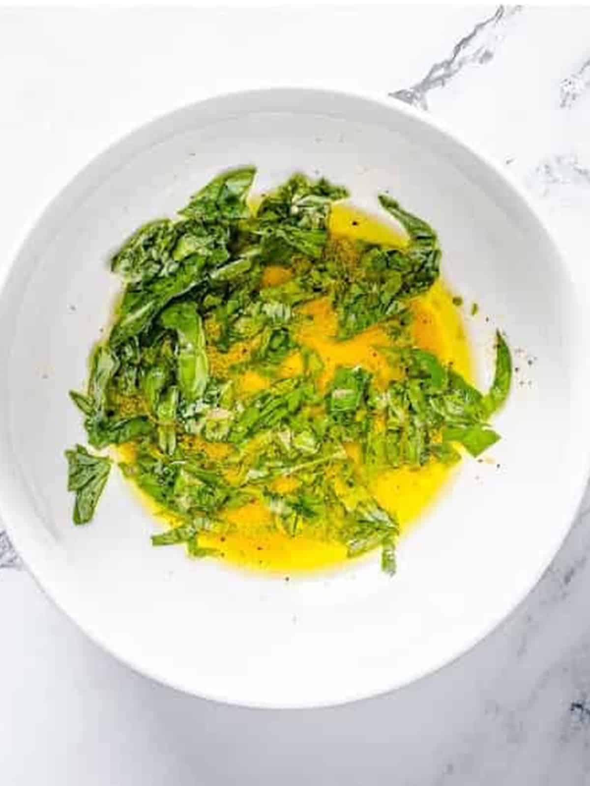 A whisked vinaigrette of olive oil, red wine vinegar, basil, and dijon mustard.