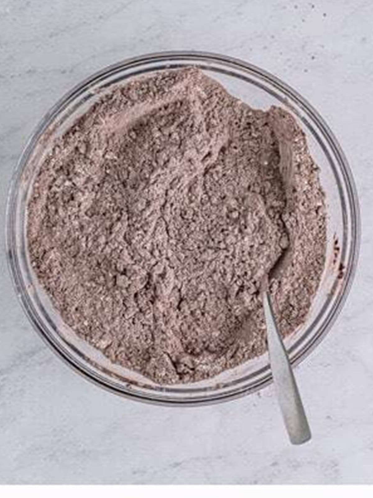 Flour, cocoa powder, baking powder, and salt whisked together in a bowl.