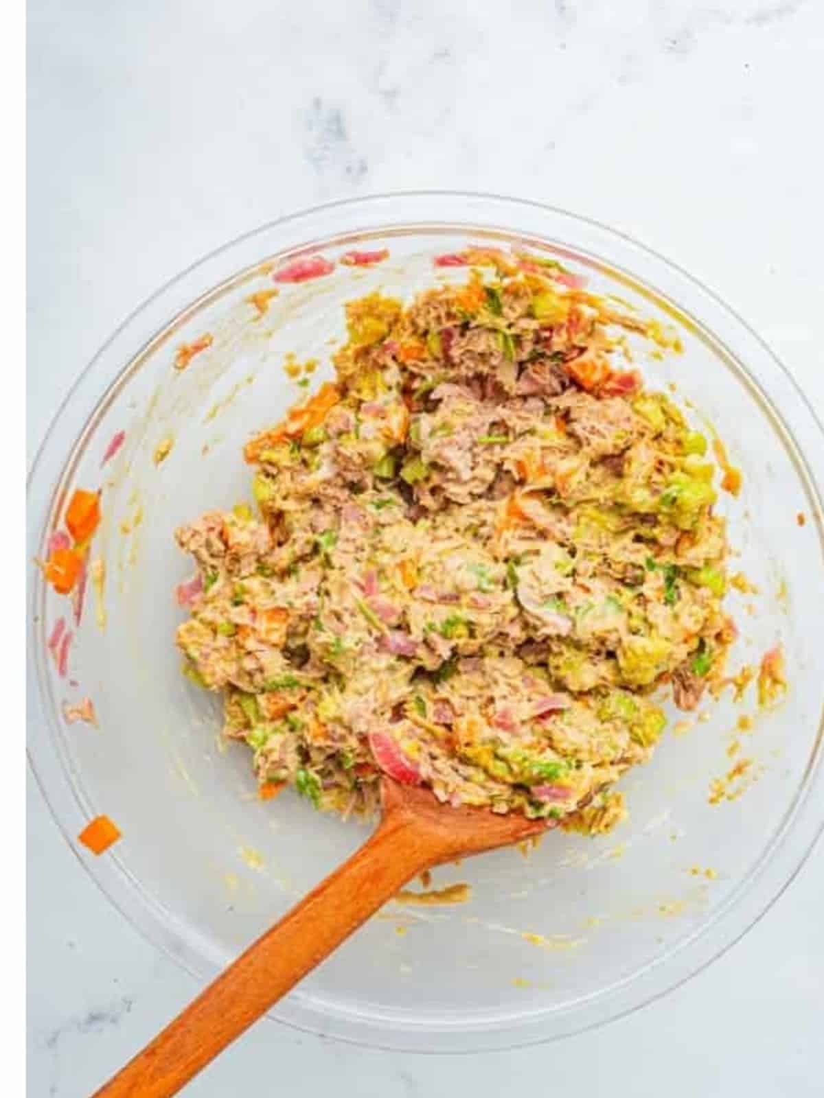 Creamy finished Avocado Tuna Salad mixed in a glass bowl.