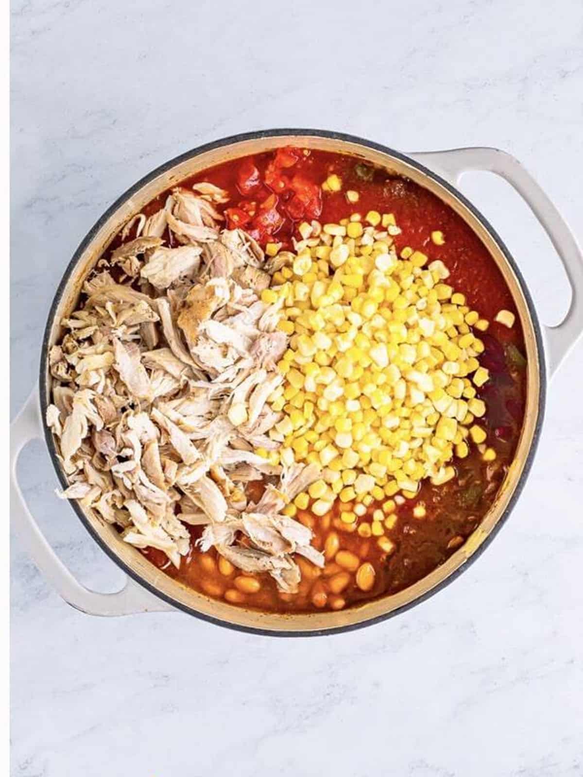 Shredded leftover turkey added to the chili pot.