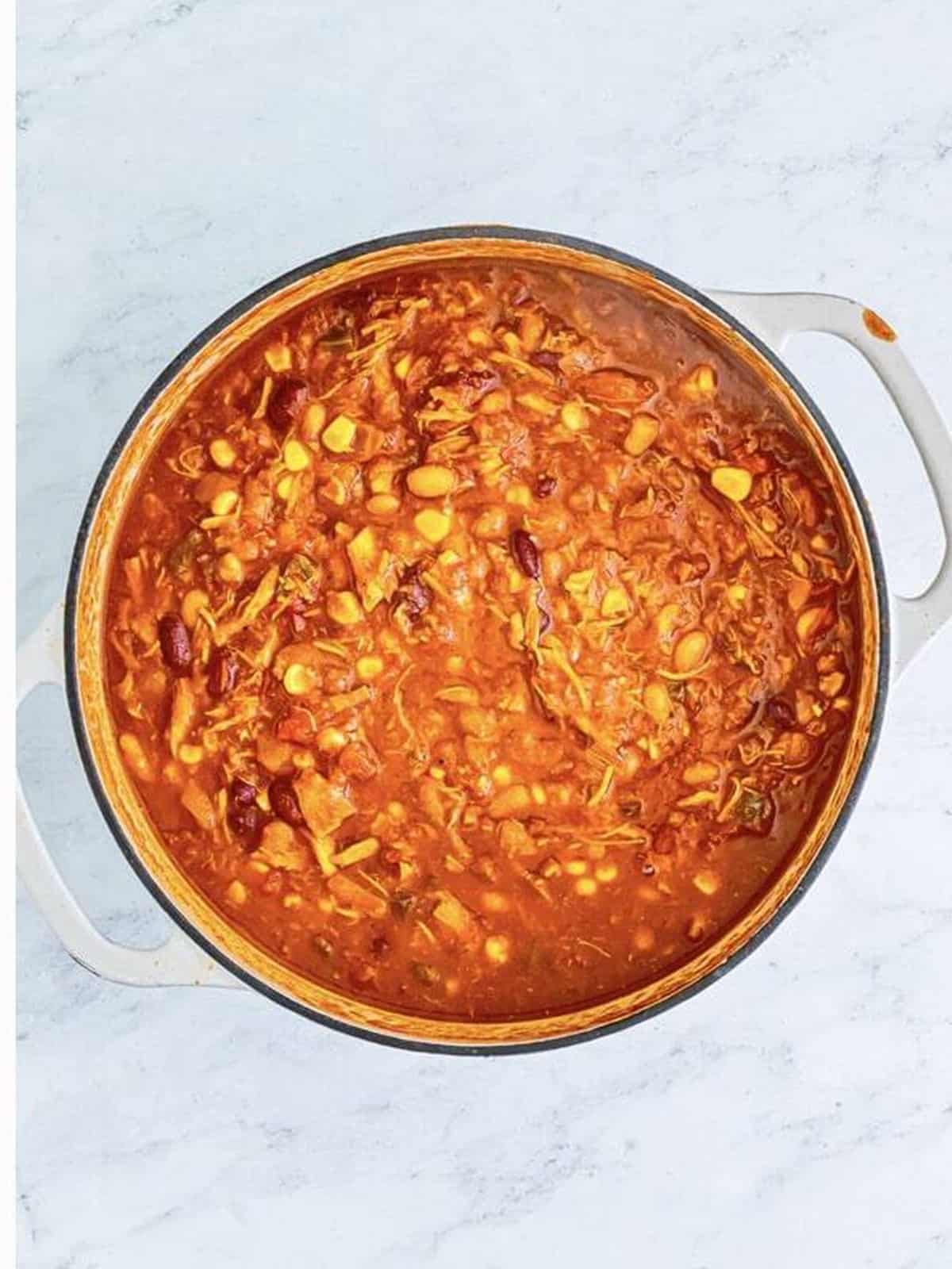 Turkey chili simmering in a pot until thick and hearty.