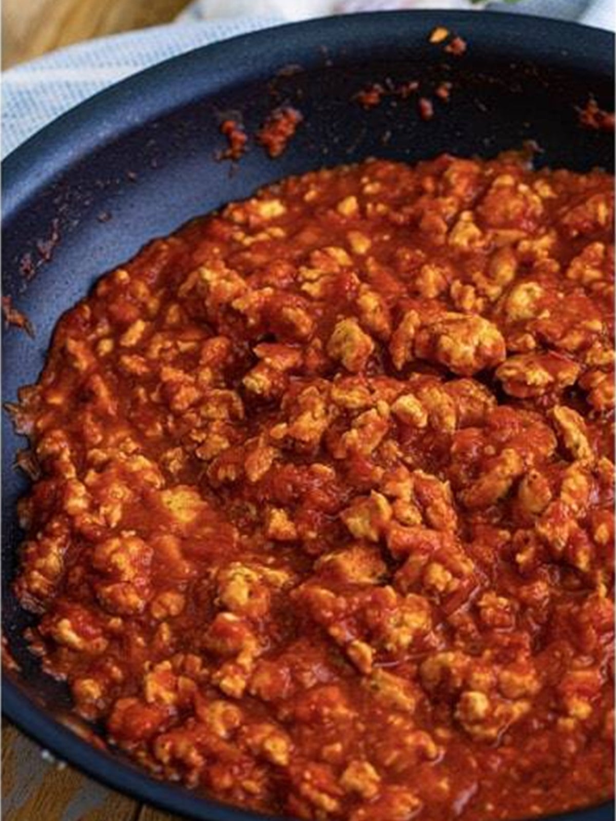 Ground turkey meat sauce simmering in a skillet.