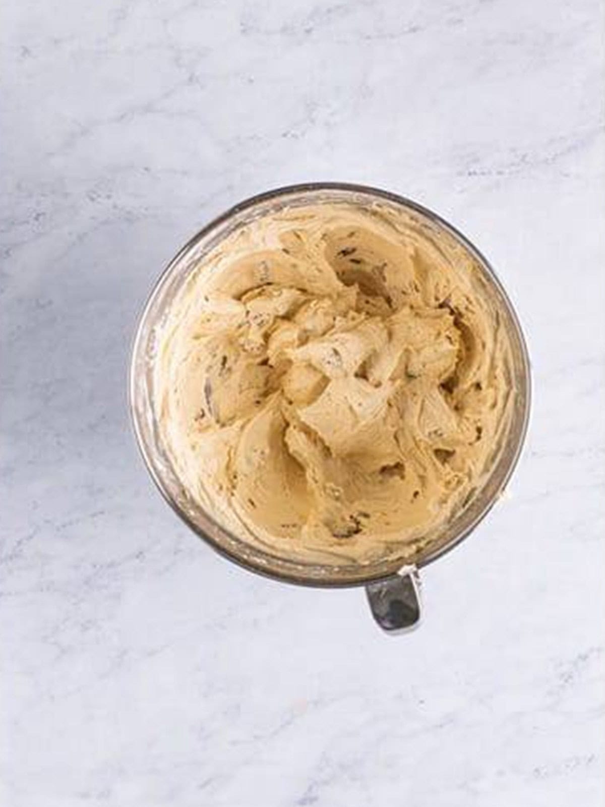 Caramel pecan frosting whipped fluffy with chopped pecans folded in.