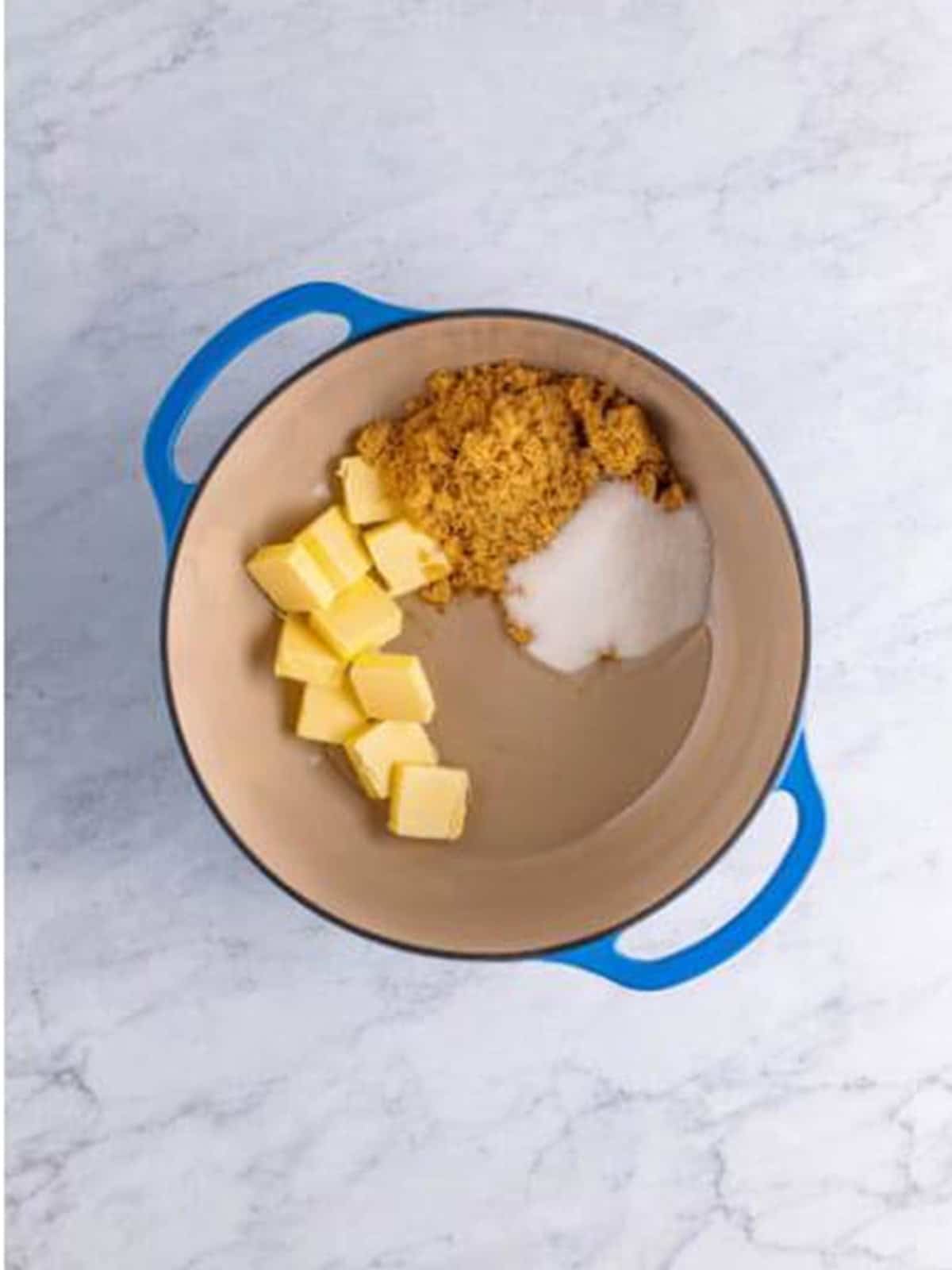 Butter, brown sugar, granulated sugar, and corn syrup in a pot.
