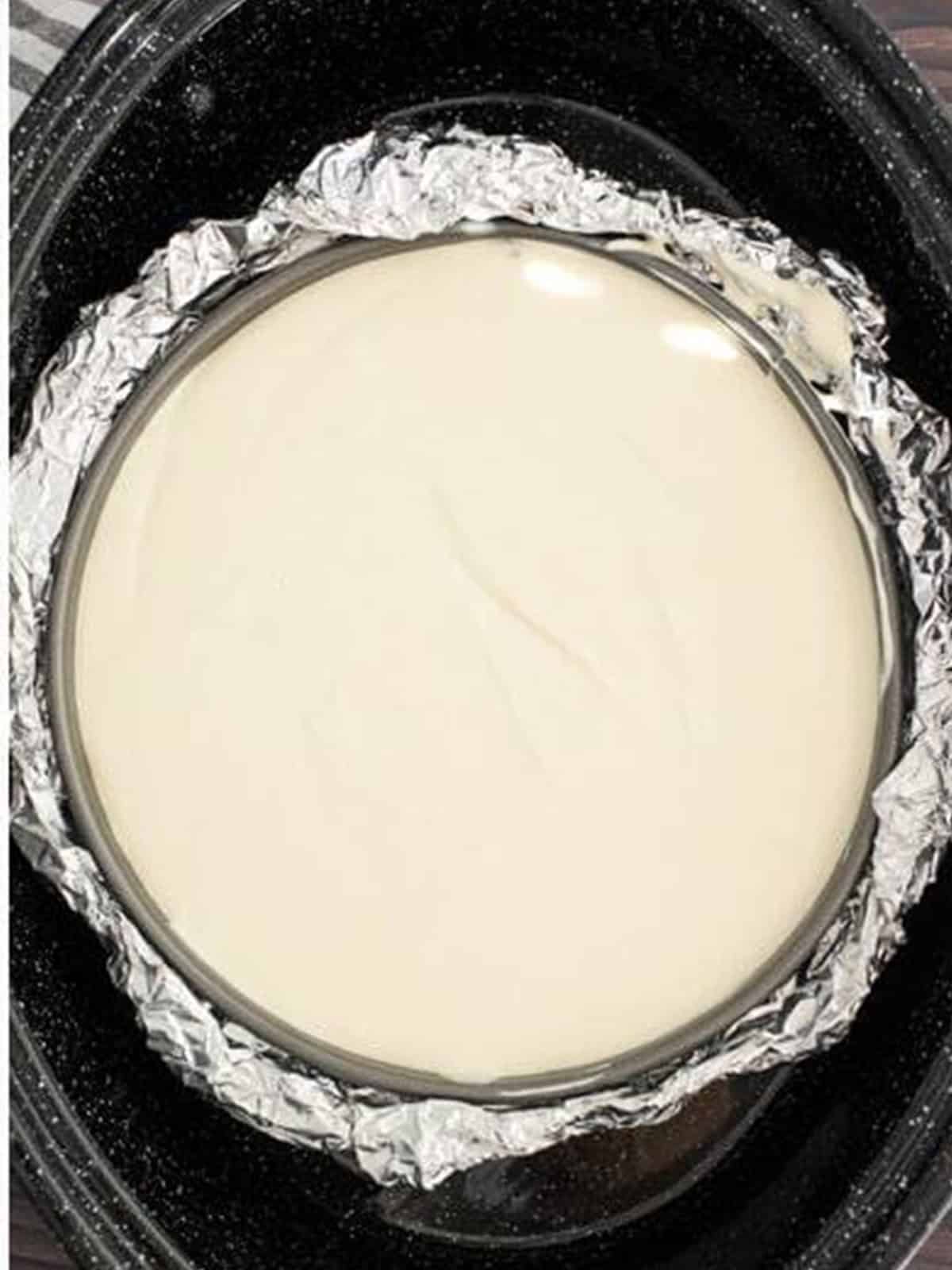 Cheesecake batter poured into the graham cracker crust.
