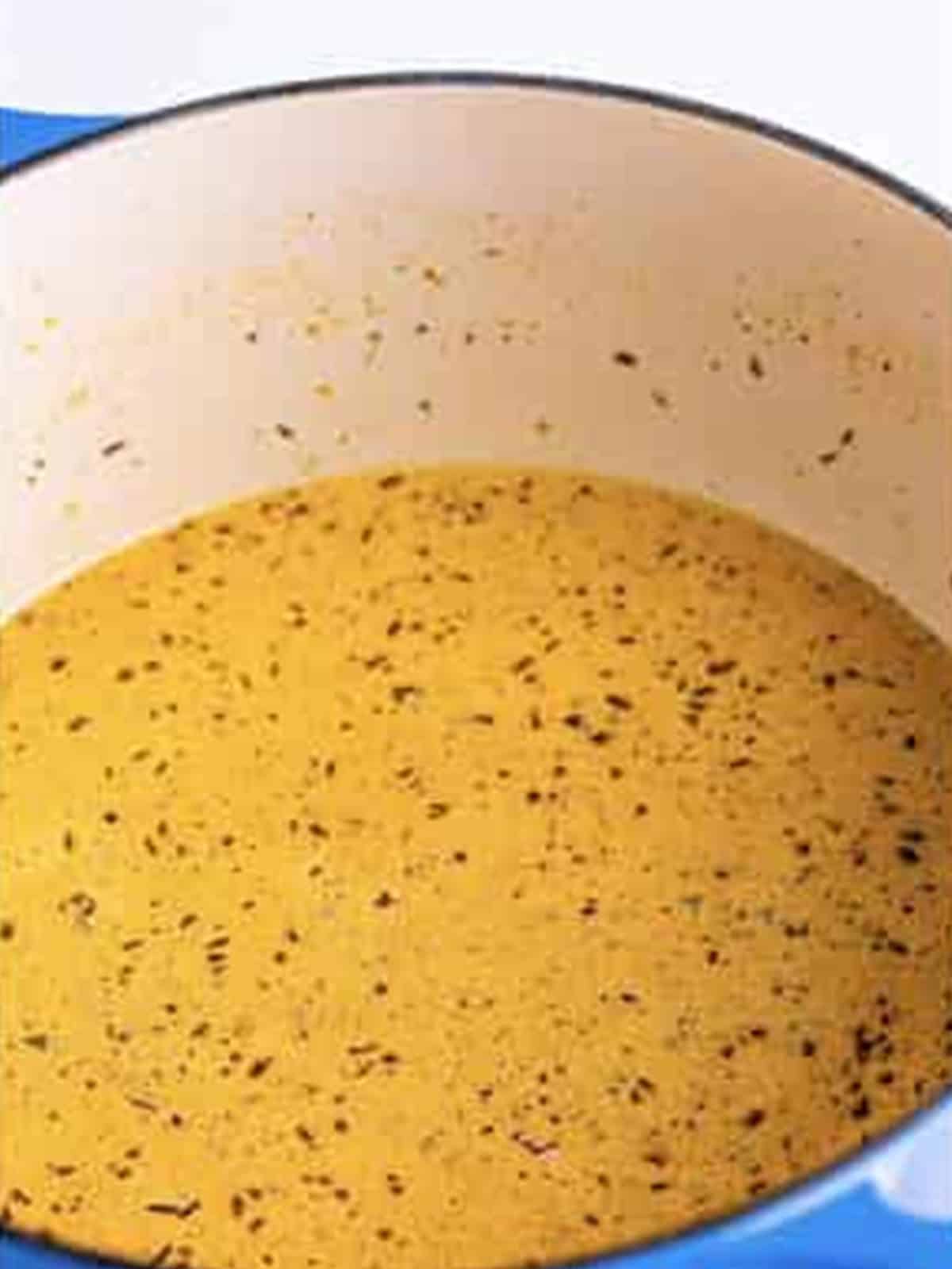 Creamy sauce simmering in the pot.