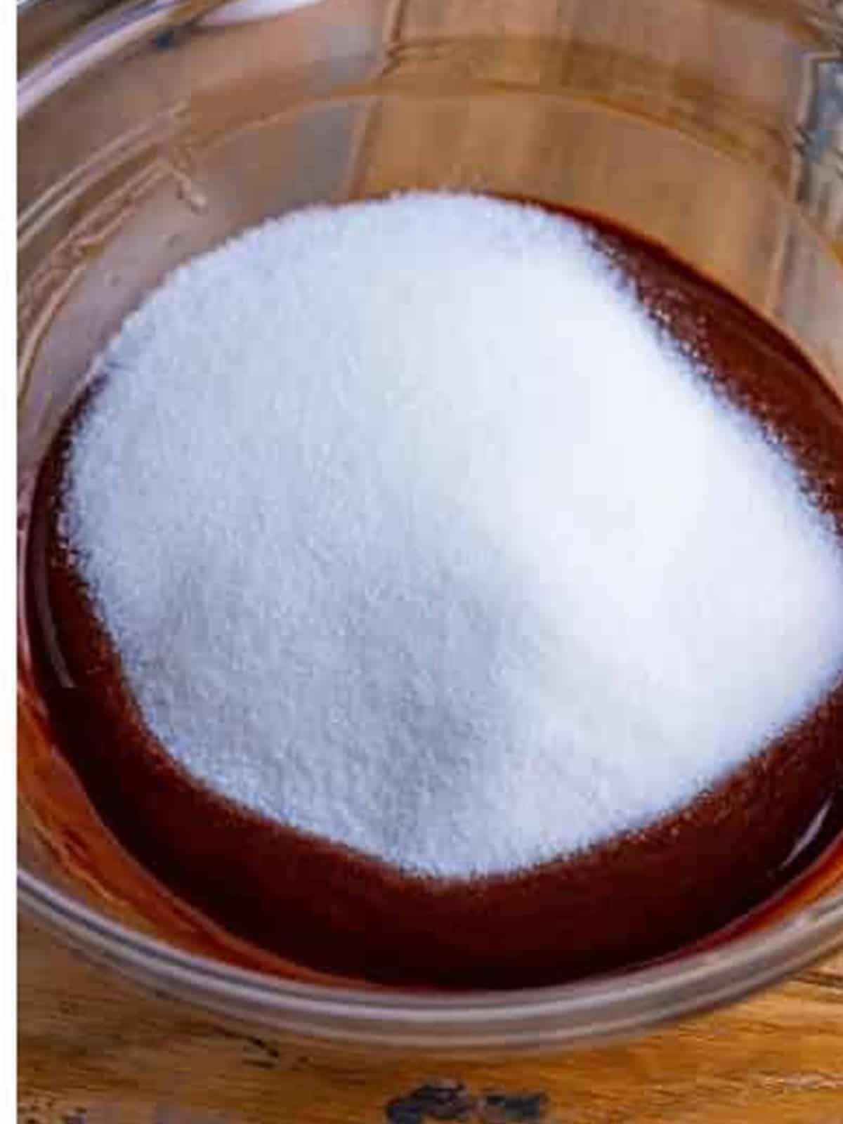 Granulated sugar added to the melted chocolate for two bite brownies.