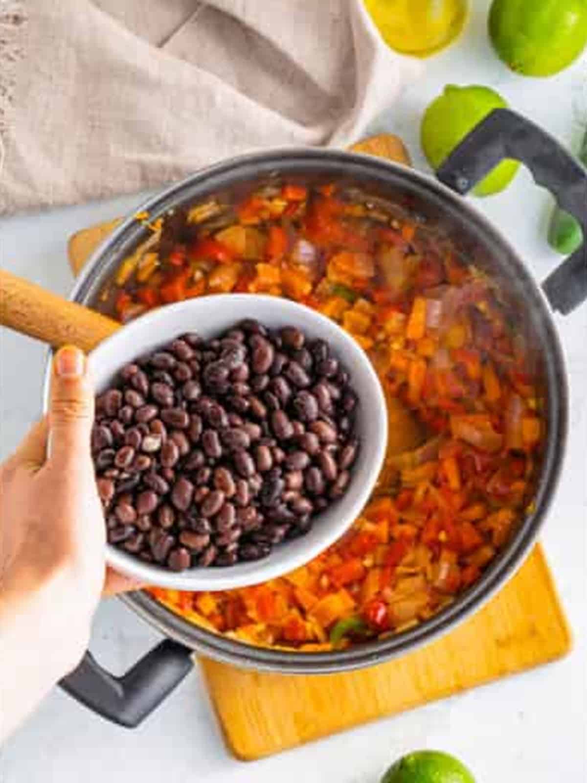 Red onion and bell pepper added to the pot with the carrots.