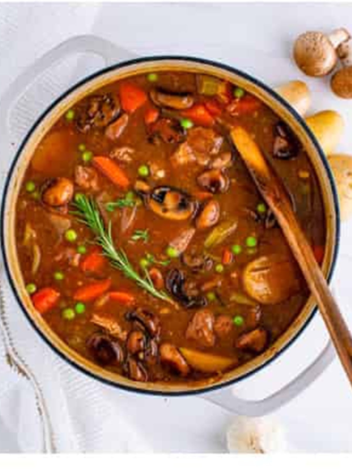 A pot of finished venison stew with tender meat and vegetables.