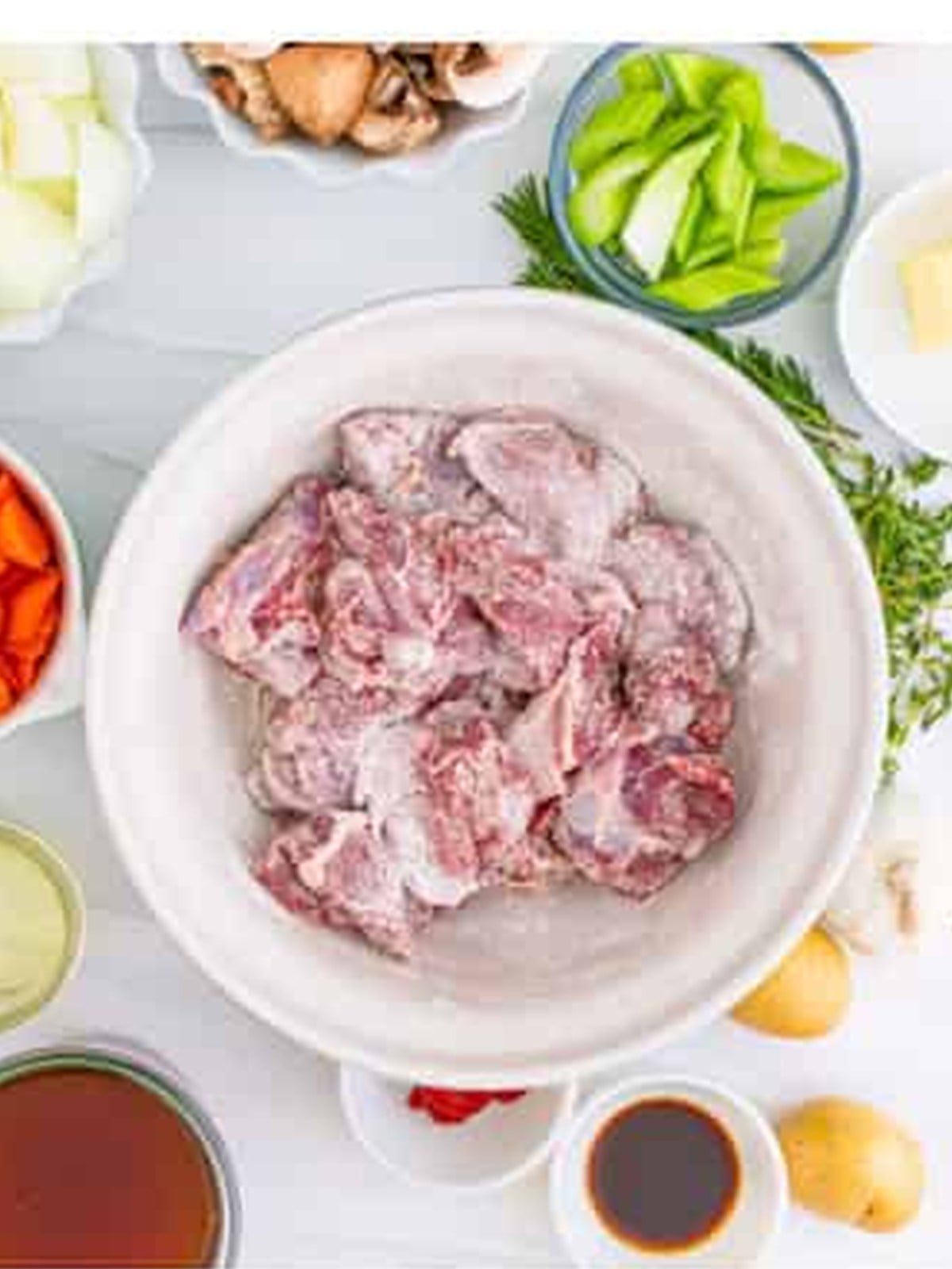Venison pieces tossed with salt, pepper, and flour to coat.