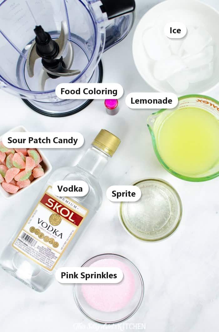 Labeled ingredients for watermelon slush including watermelon, vodka, Sour Patch candy, Sprite, lemonade, ice, food coloring, and pink sprinkles.