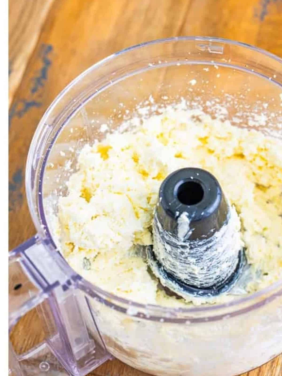Pulsing the feta and cream cheese into a crumbly mixture for Whipped Feta Dip.