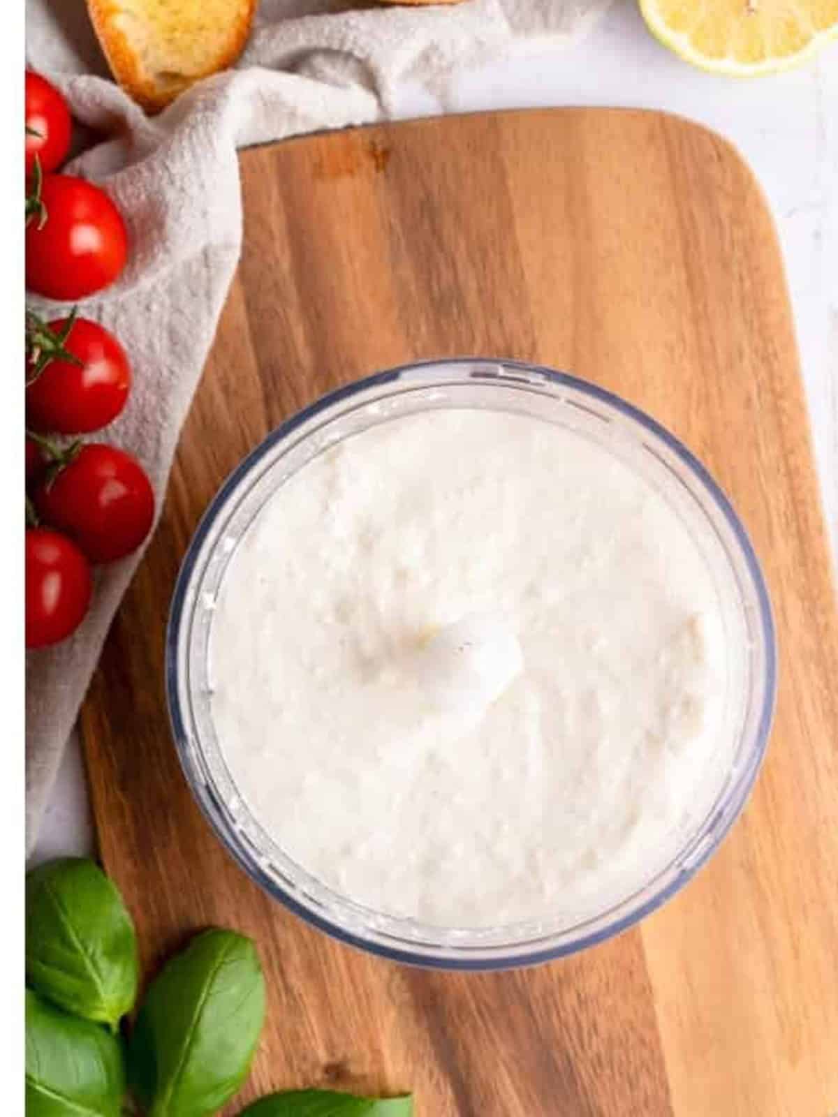 Smooth whipped ricotta cheese in a food processor.