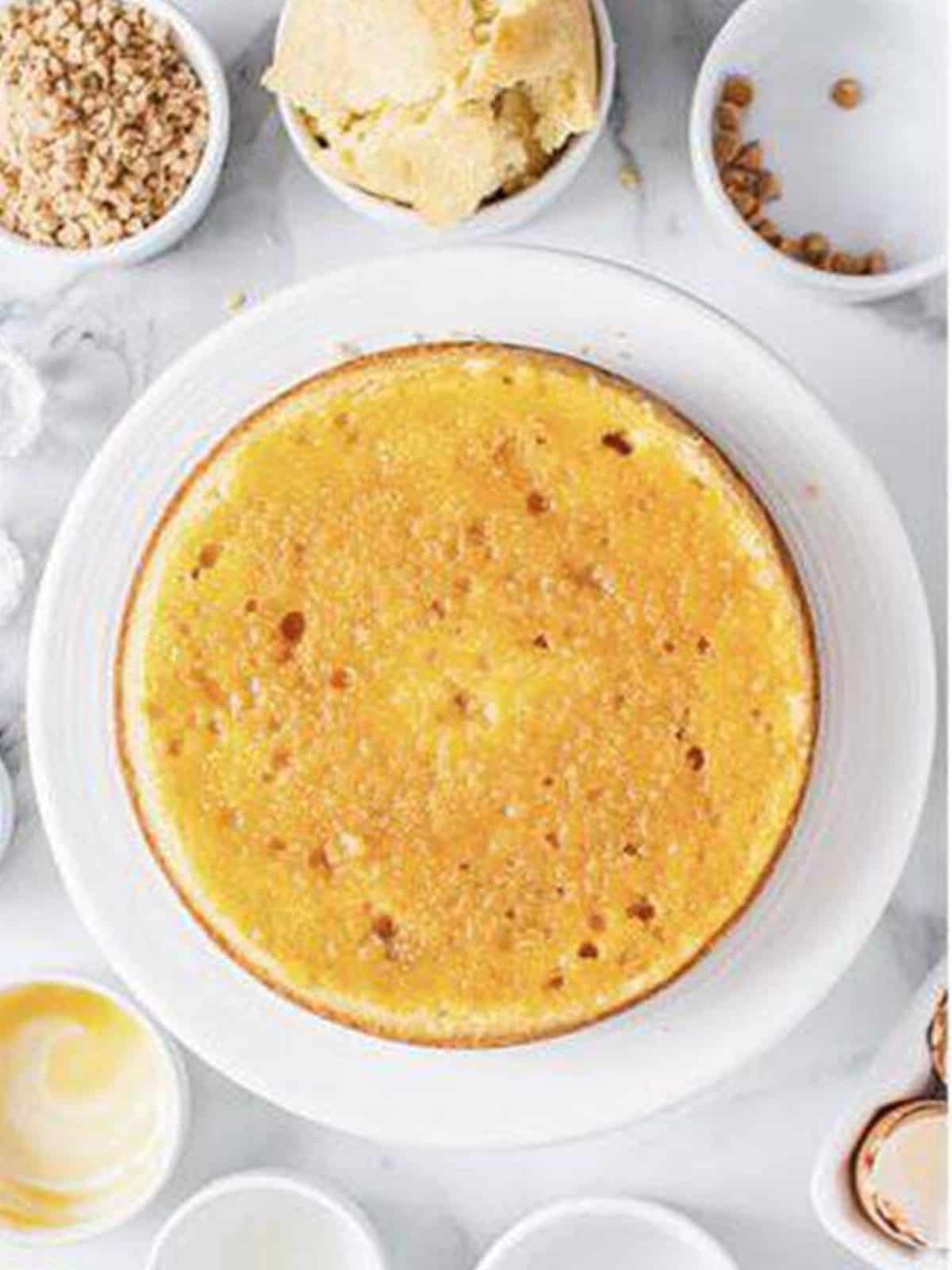 A golden baked cake layer for white chocolate mousse cake.