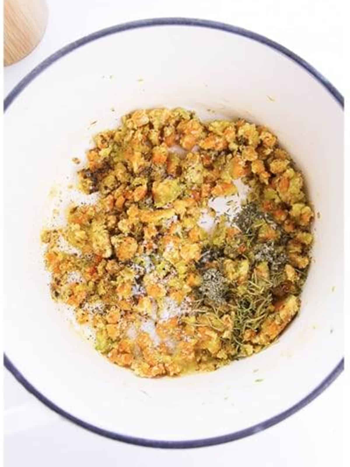 Flour and poultry seasoning stirred into the cooked vegetables to make a roux.