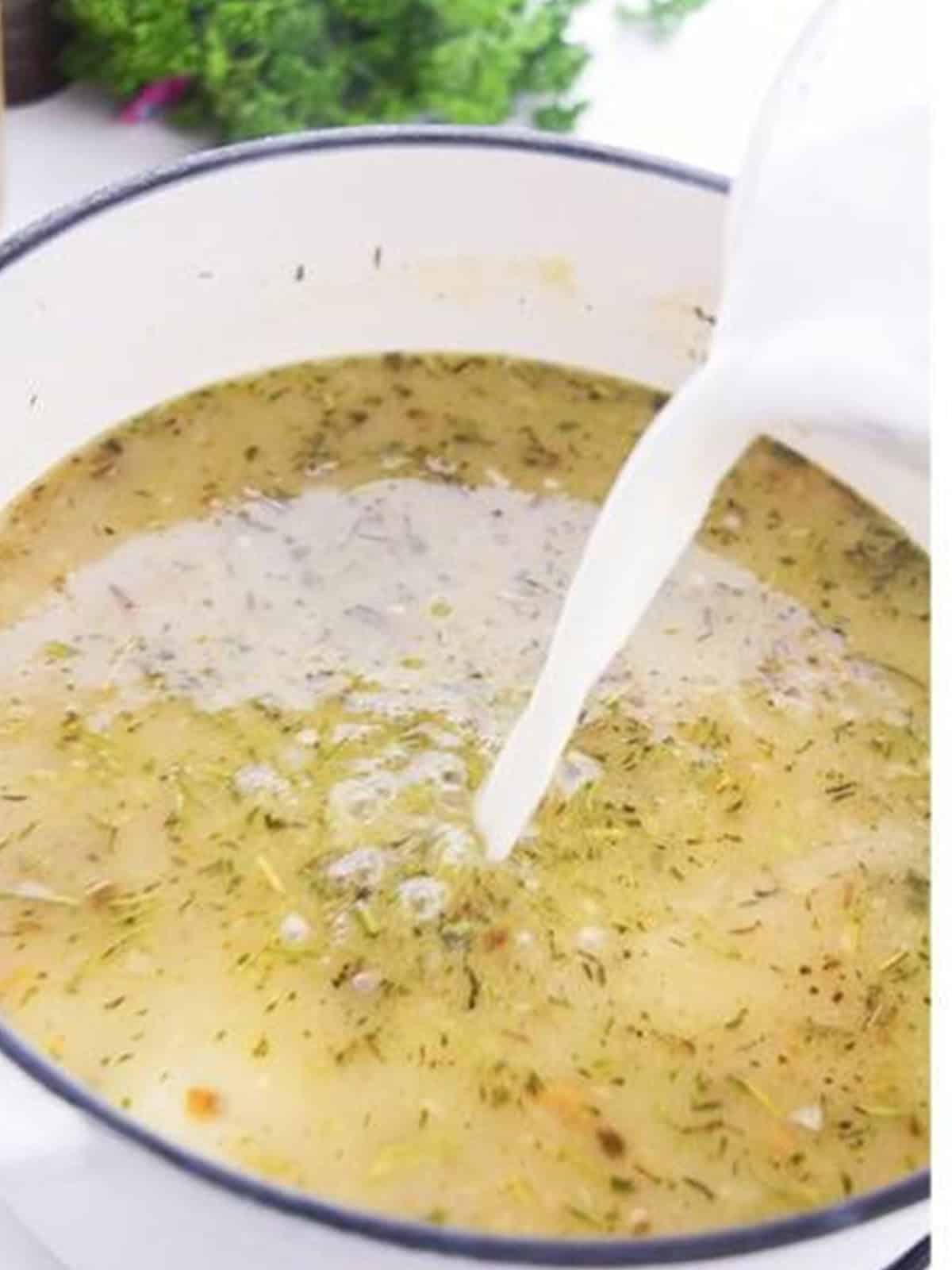 The wild rice soup simmering and thickening in the pot.