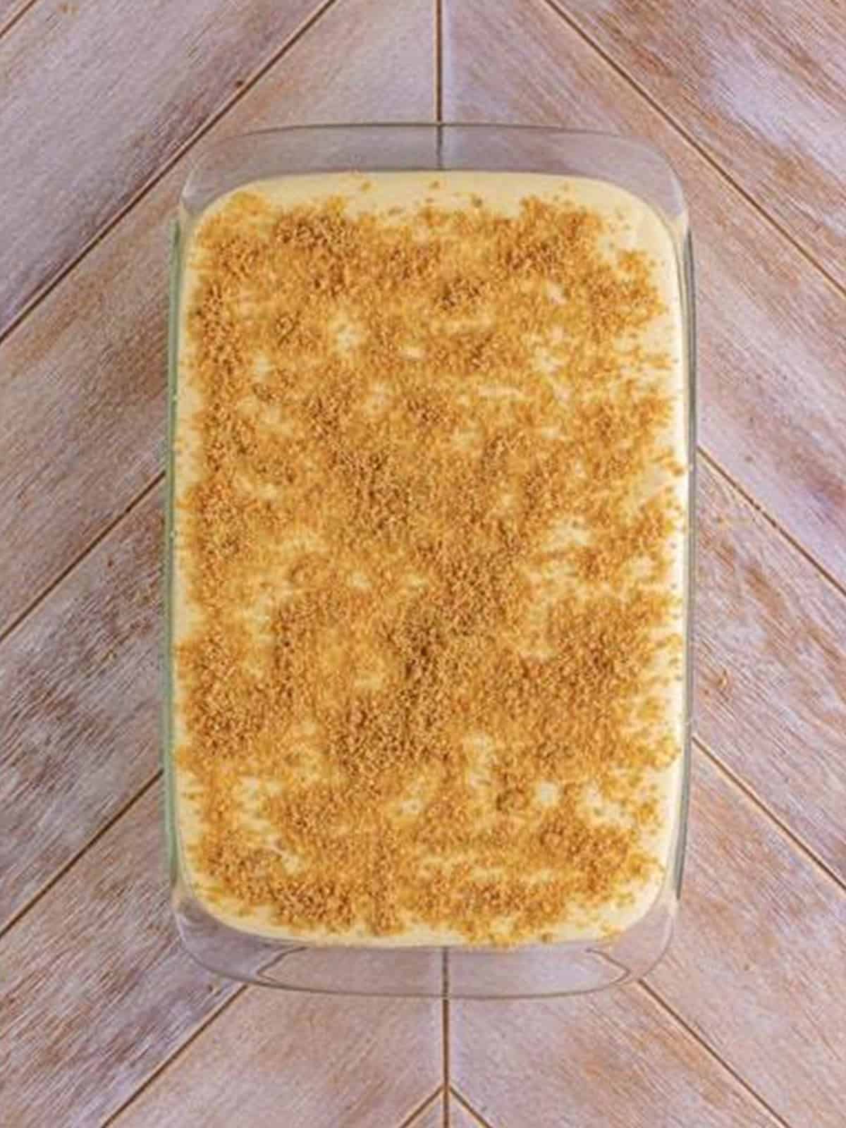 Reserved graham cracker crumbs sprinkled over the woolworth cheesecake before chilling overnight.