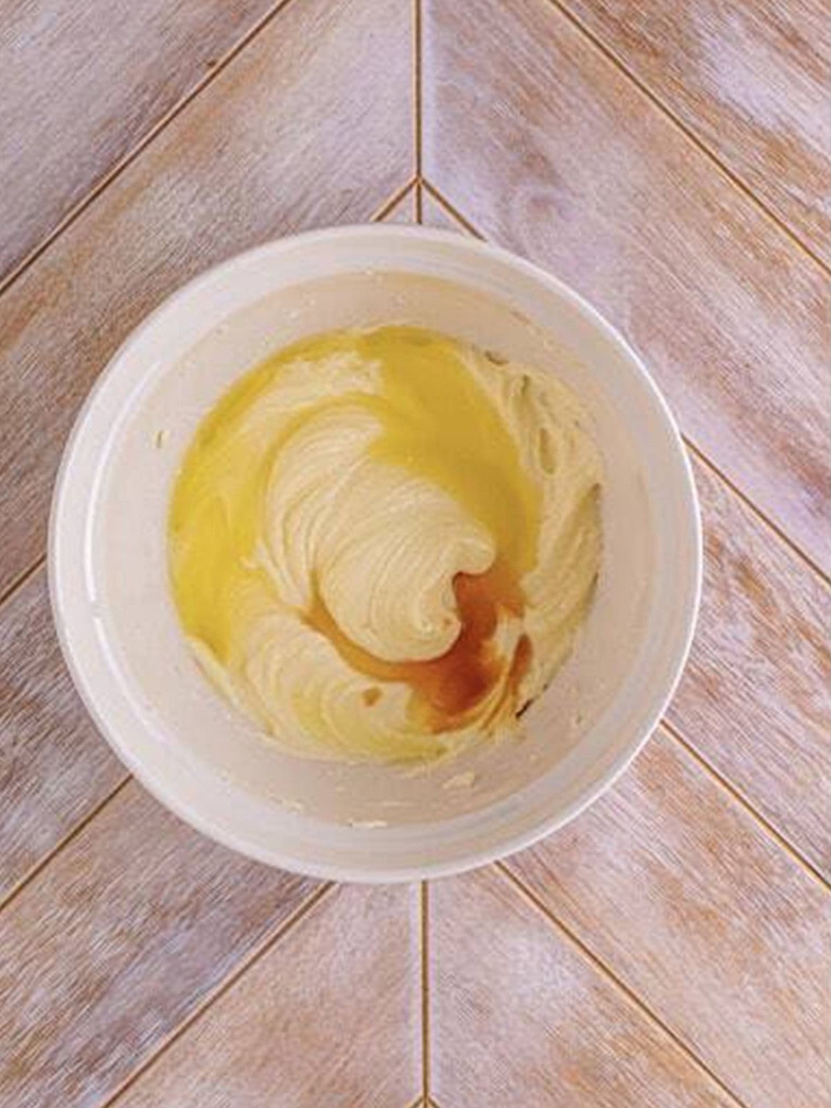 Lemon juice and vanilla extract added to the whipped cream cheese mixture for woolworth cheesecake recipe.