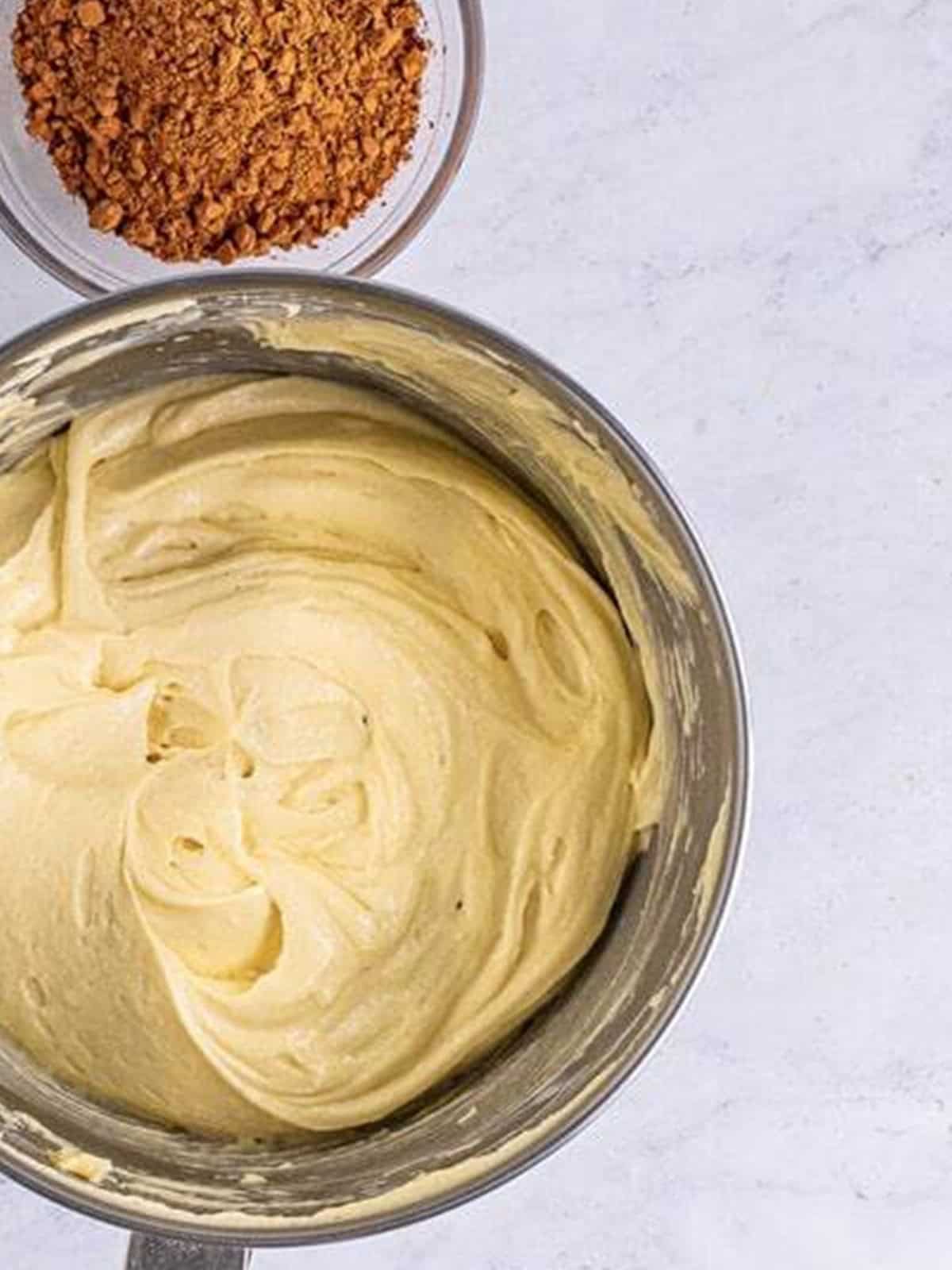 Smooth Yellow Cake batter in a stand mixer bowl.