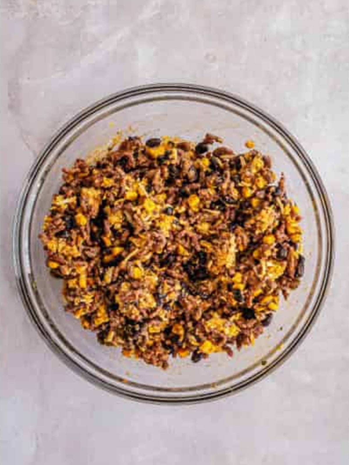 Mixed enchilada beef filling for stuffed zucchini boats.