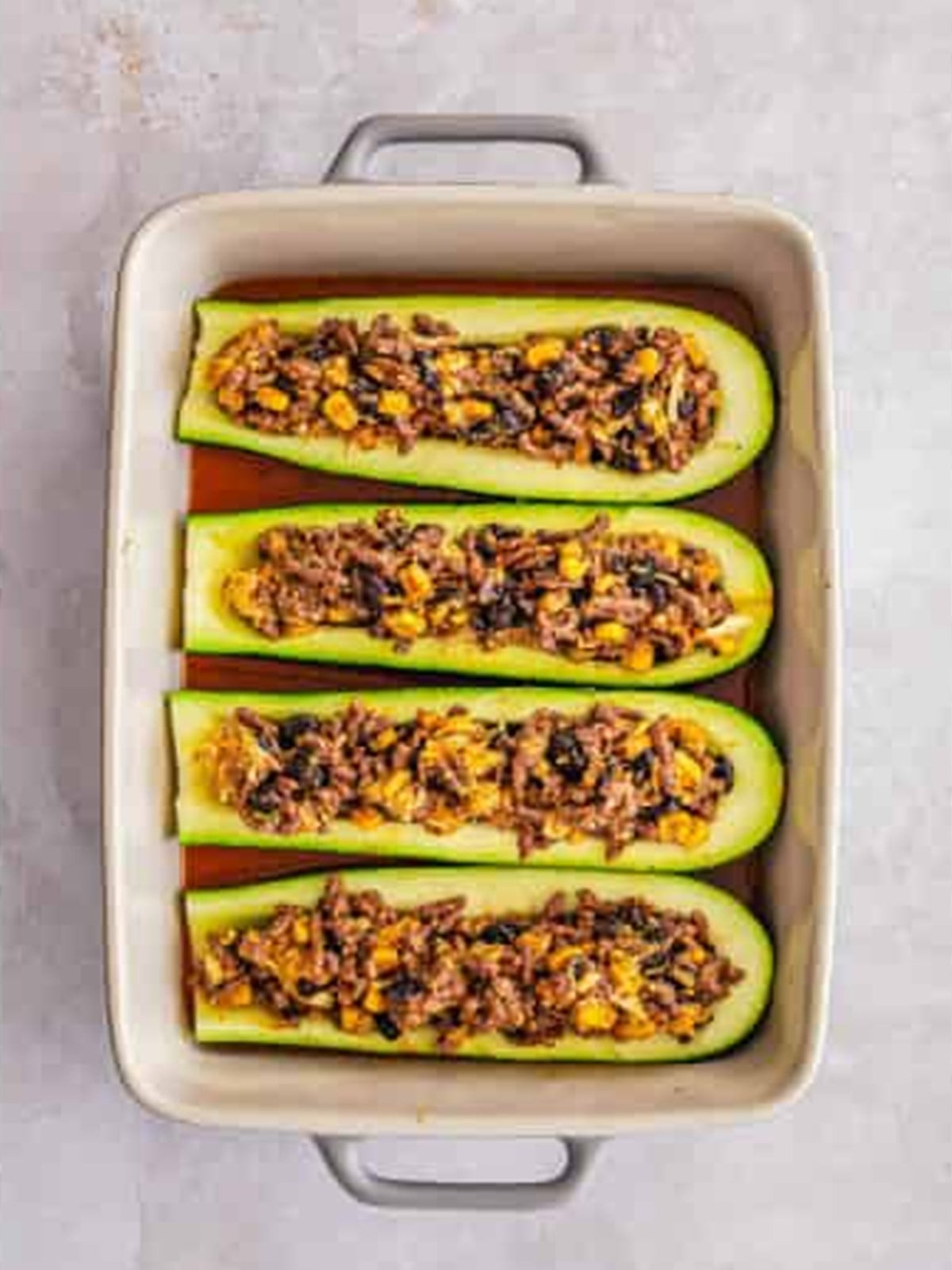 Zucchini boats stuffed with the enchilada beef and bean filling.