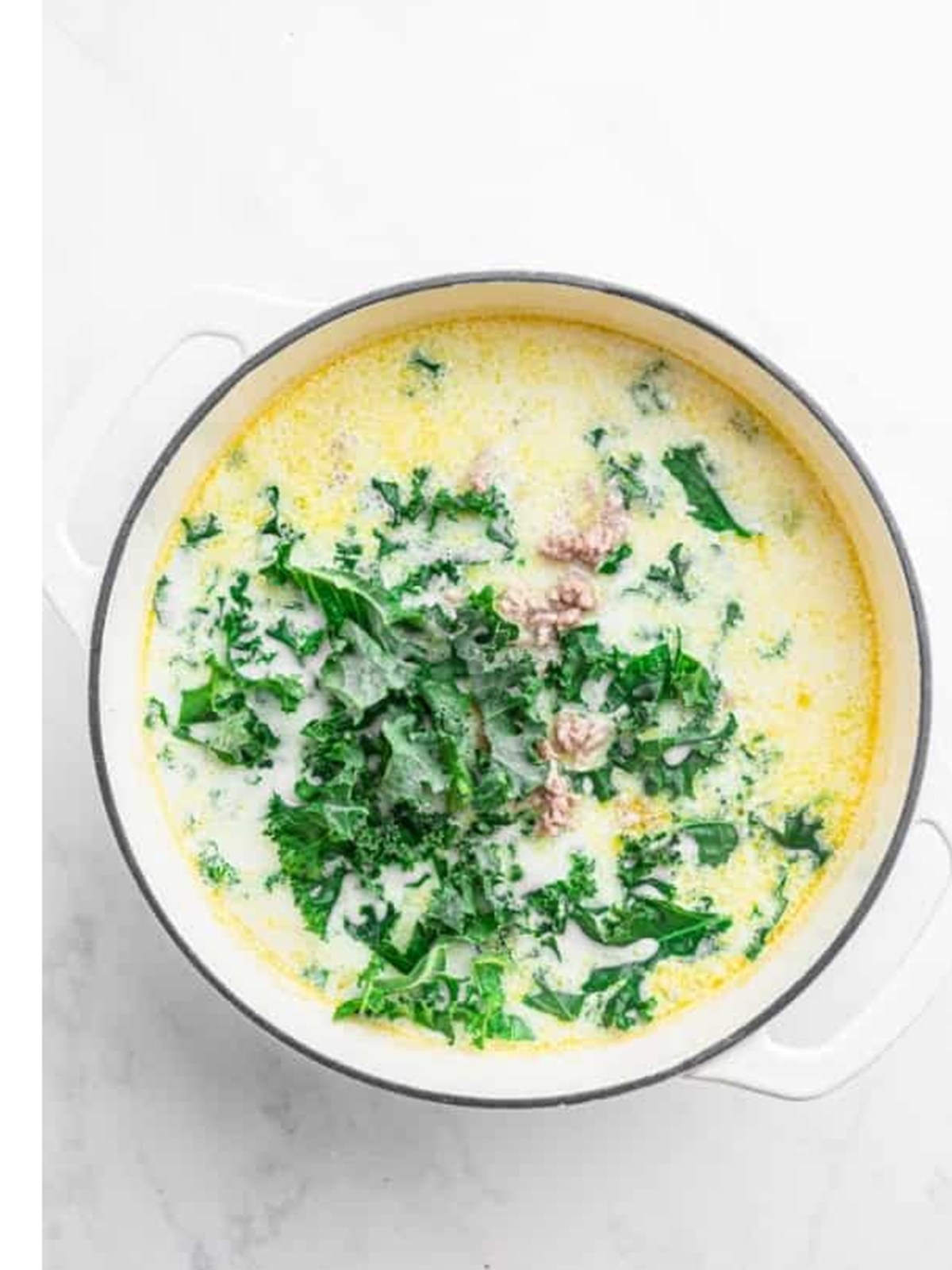 Finished Zuppa Toscana with kale and Italian sausage stirred into the creamy soup.