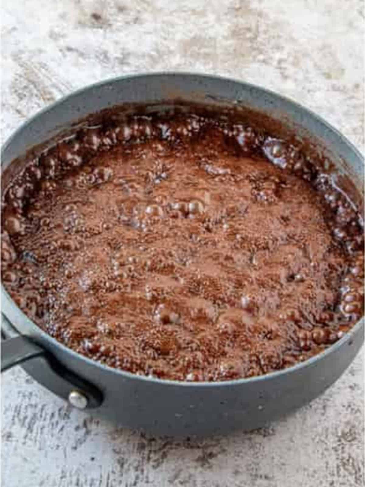 Chocolate mixture boiling in the saucepan for one minute
