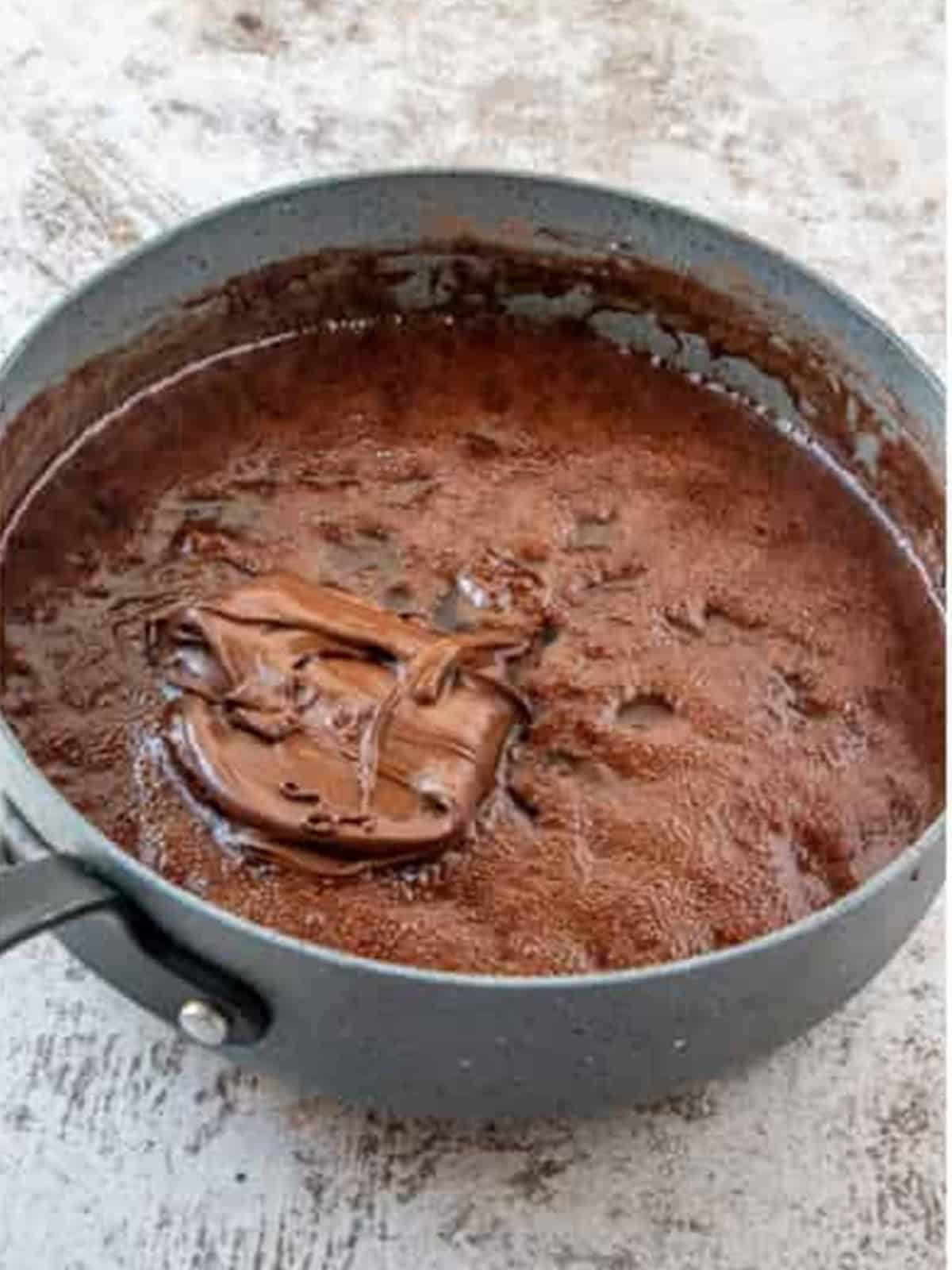 Nutella, vanilla, and coconut extract added to the hot chocolate mixture