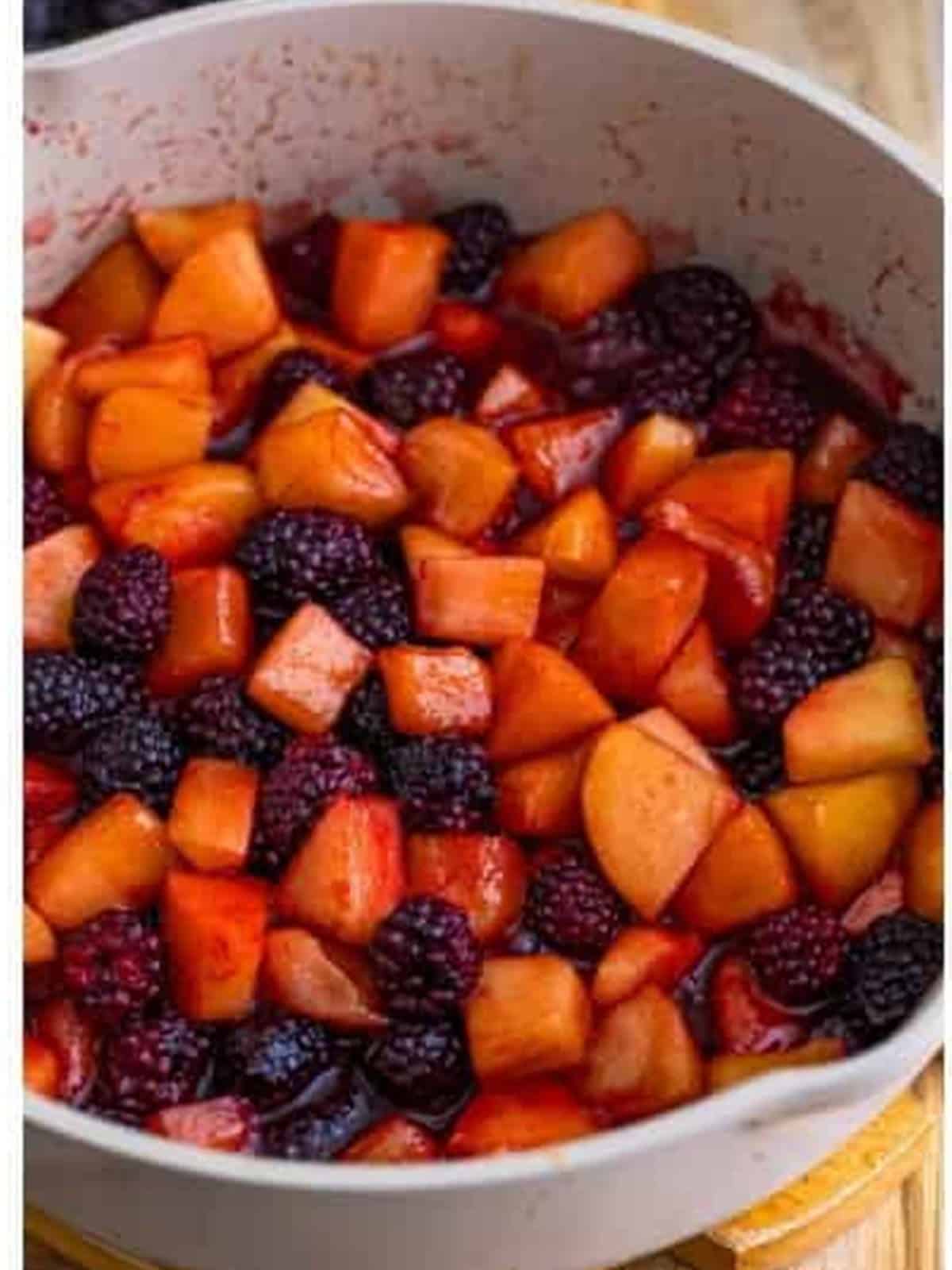 Apples and blackberries cooked together into a thick, jammy fruit filling.