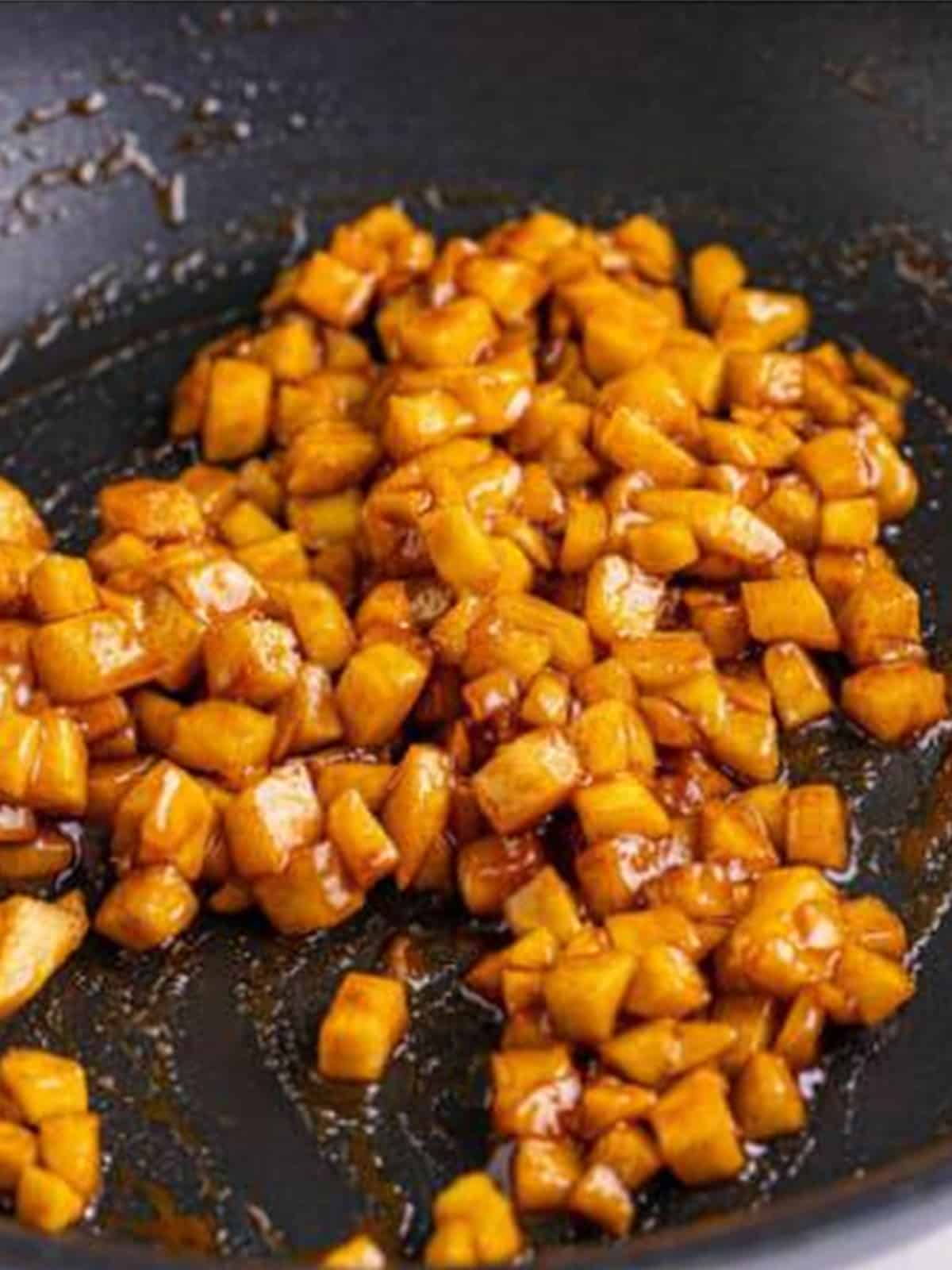 Diced apples simmering in the cinnamon brown sugar butter until tender crisp.