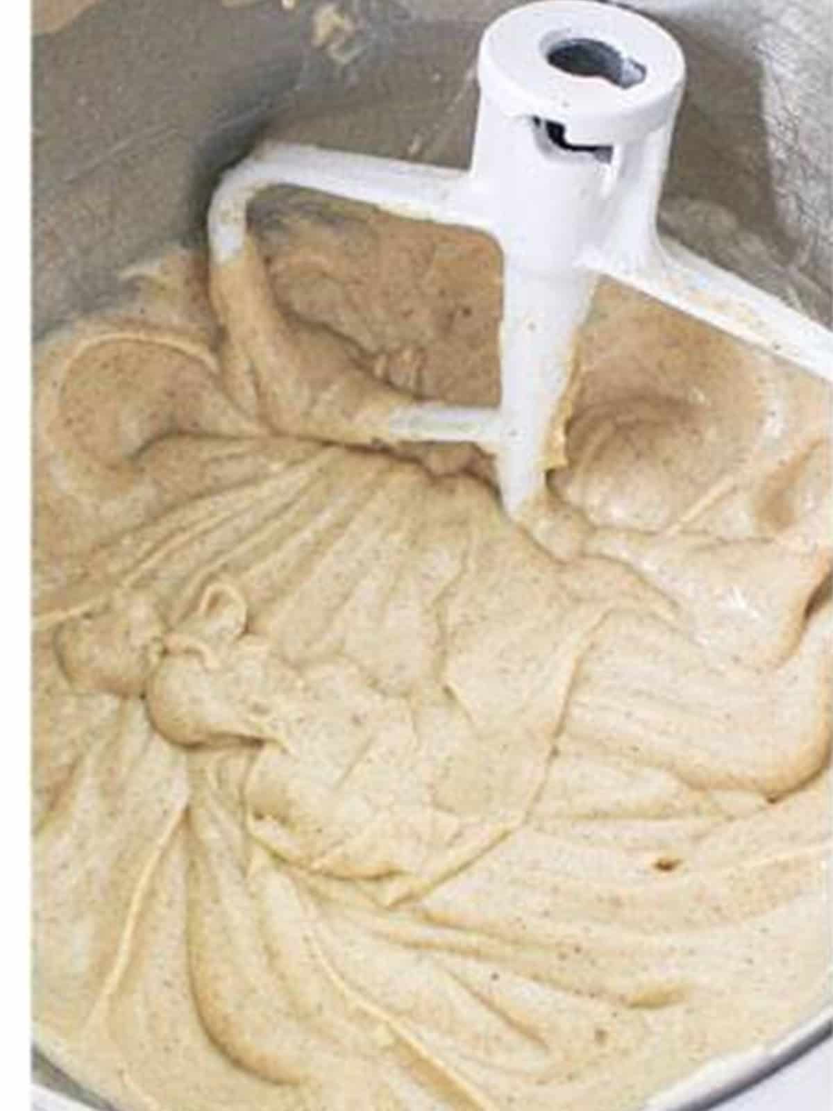 Spiced cupcake batter mixed smooth in the mixer bowl.