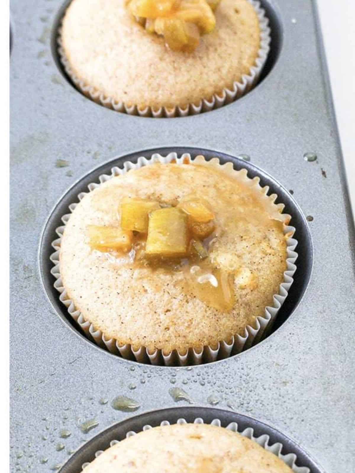 Cored cupcakes filled with homemade apple pie filling.