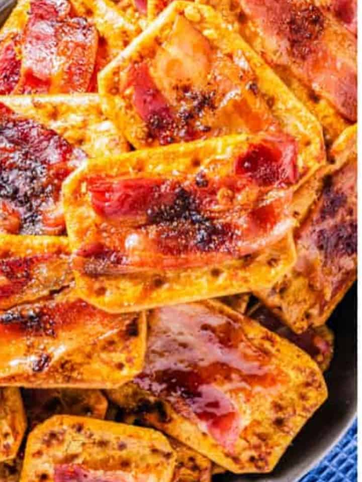 Baked Bacon Crackers with caramelized brown sugar glaze and crispy bacon.