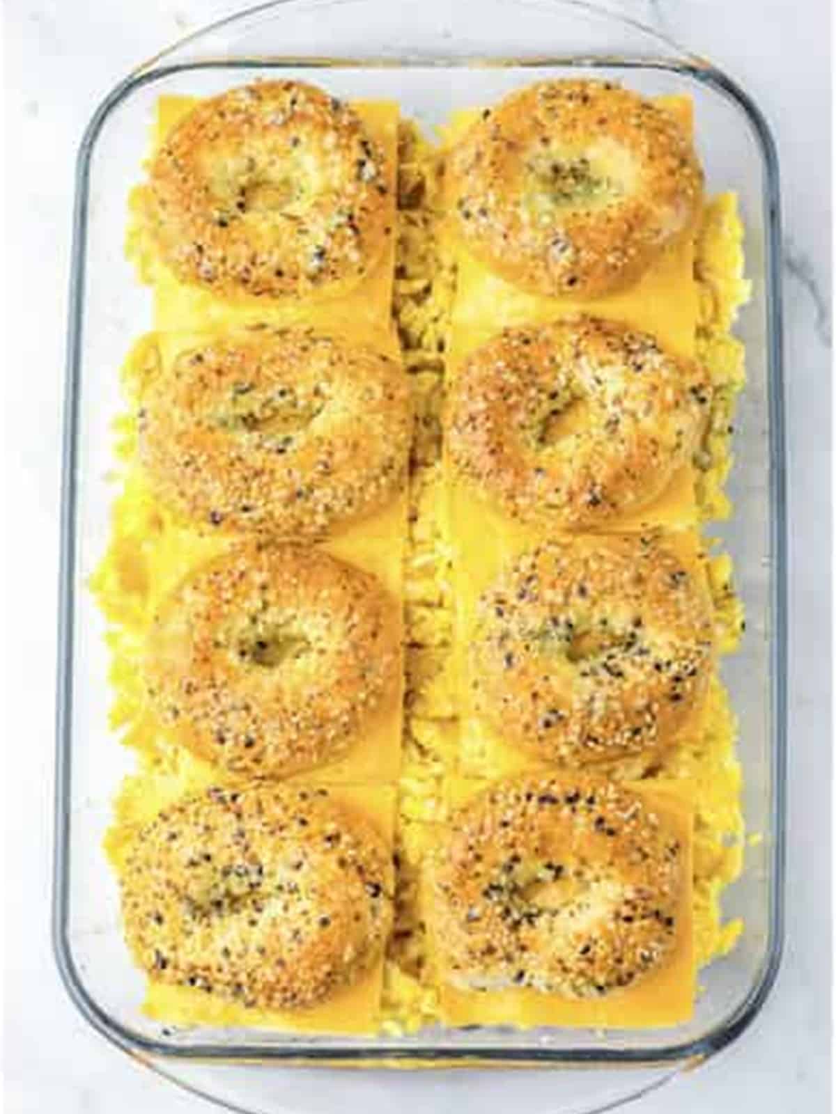 Everything bagel tops added and brushed with garlic butter for breakfast sliders.